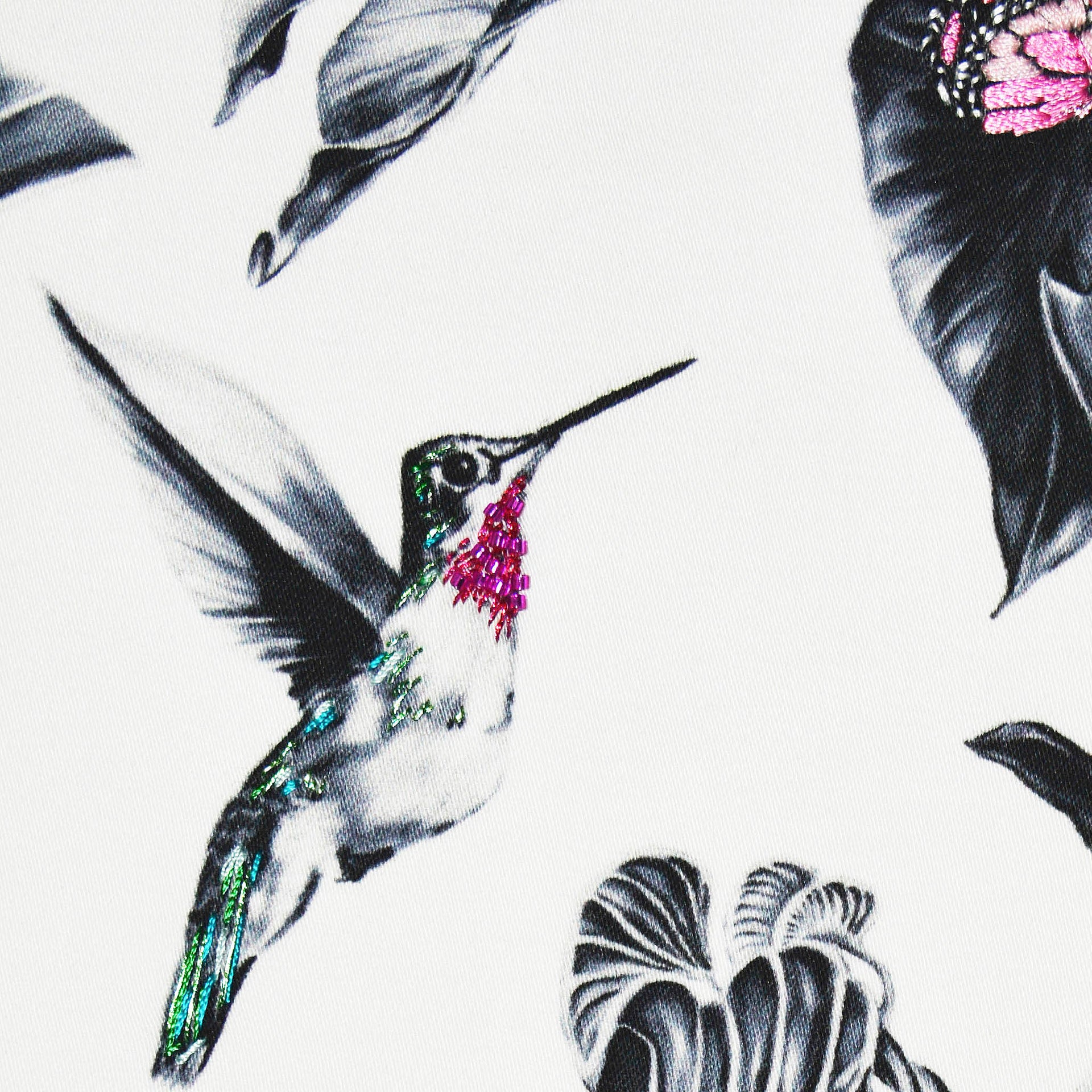 Hummingbird hand embroidered artwork close up