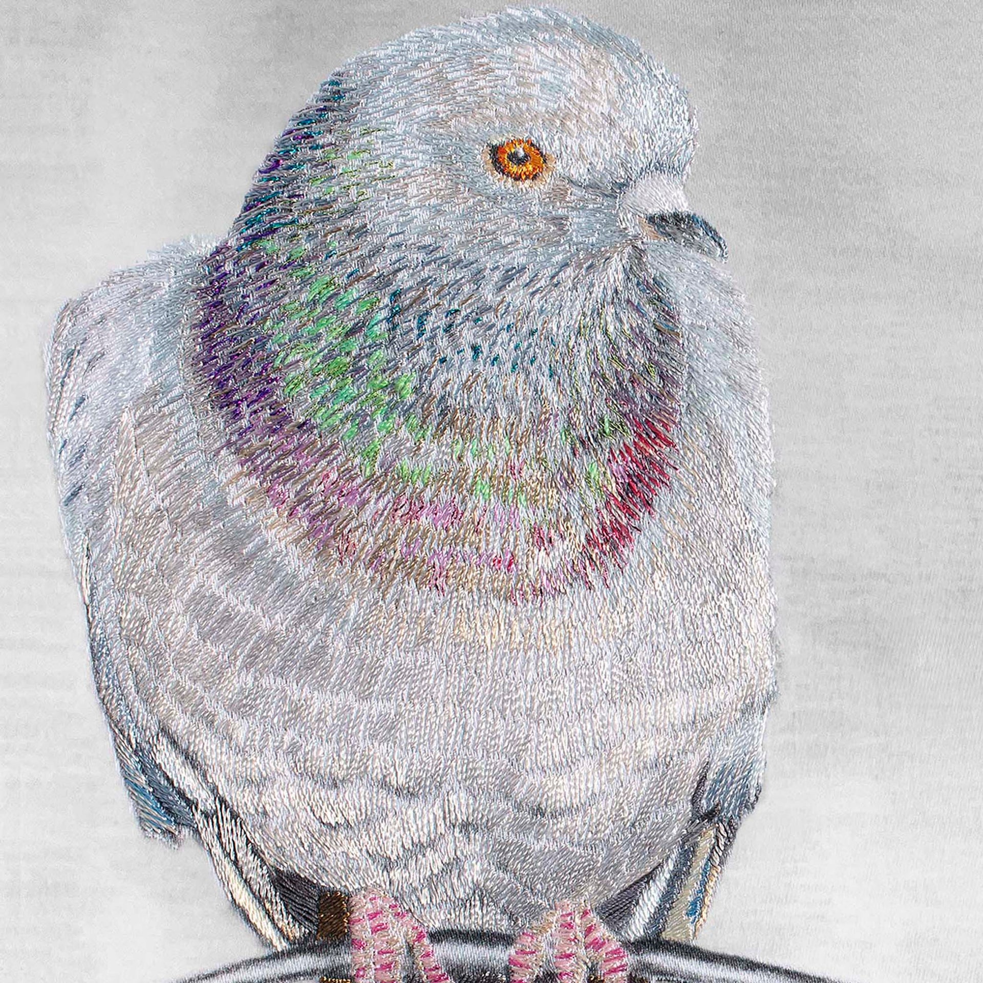 Pigeon hand embroidered wall art close up.