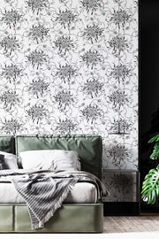 Botanical floral wallpaper on bedroom wall.