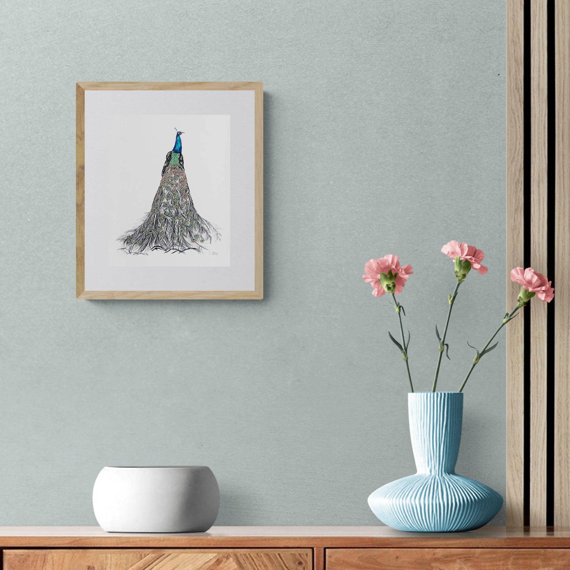 Peacock hand embroidered limited edition print in frame on the wall