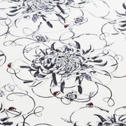 Monochrome floral large square cushion with hand embroidered ladybirds close up