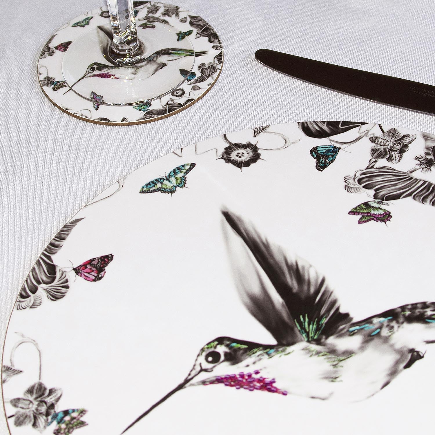 White hummingbird coaster on table close up