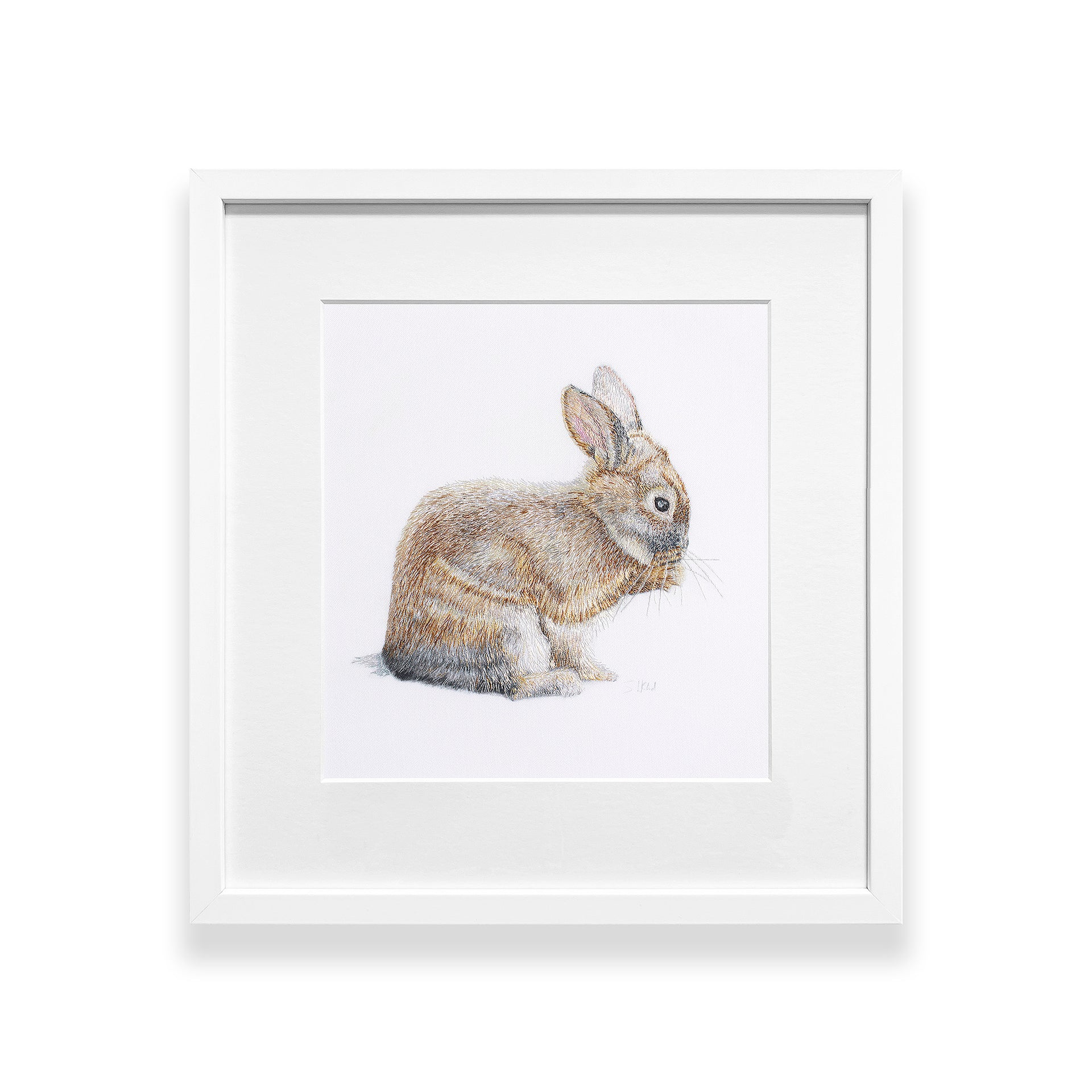 Hand embroidered bunny rabbit in a white frame