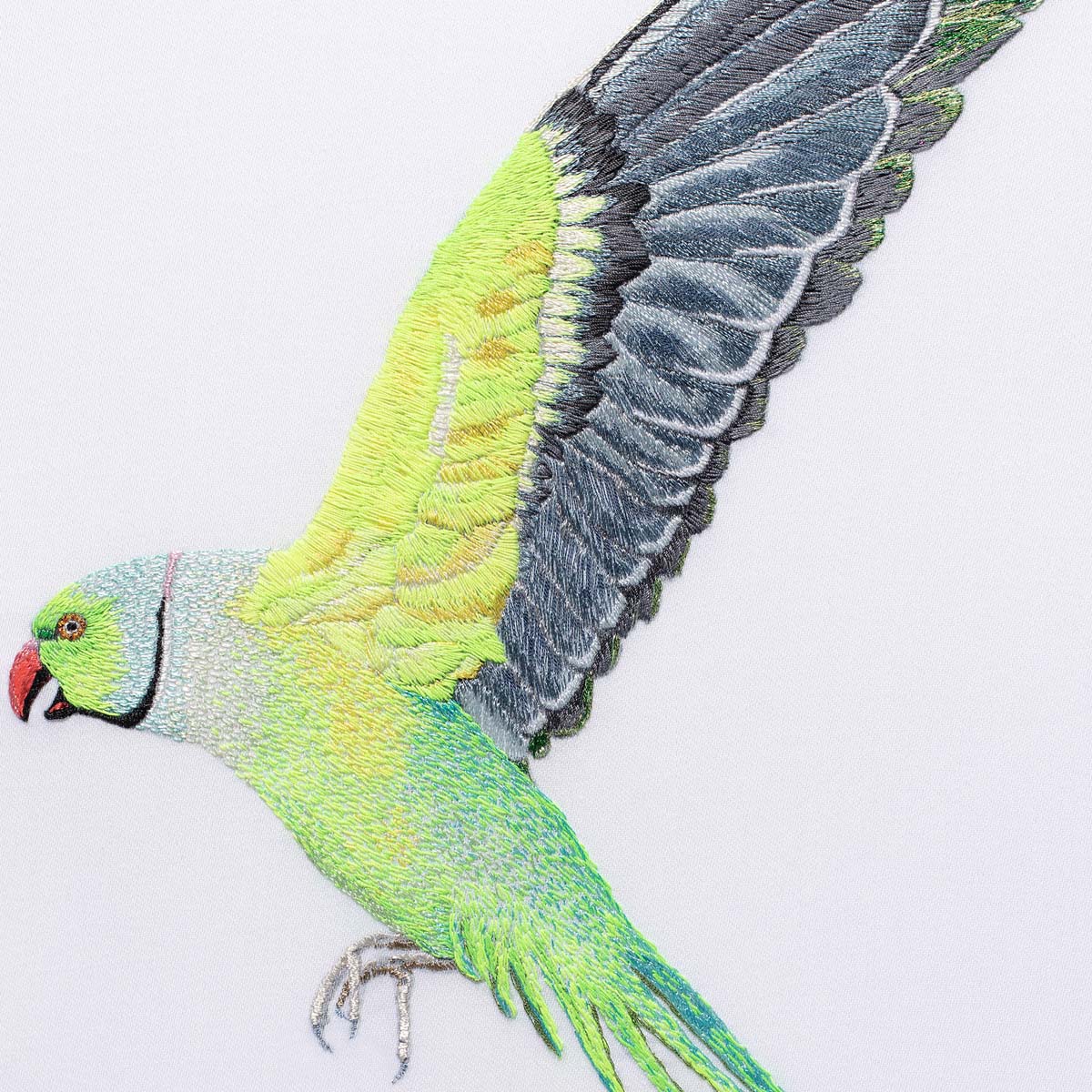 Hand embroidered flying parakeet artwork