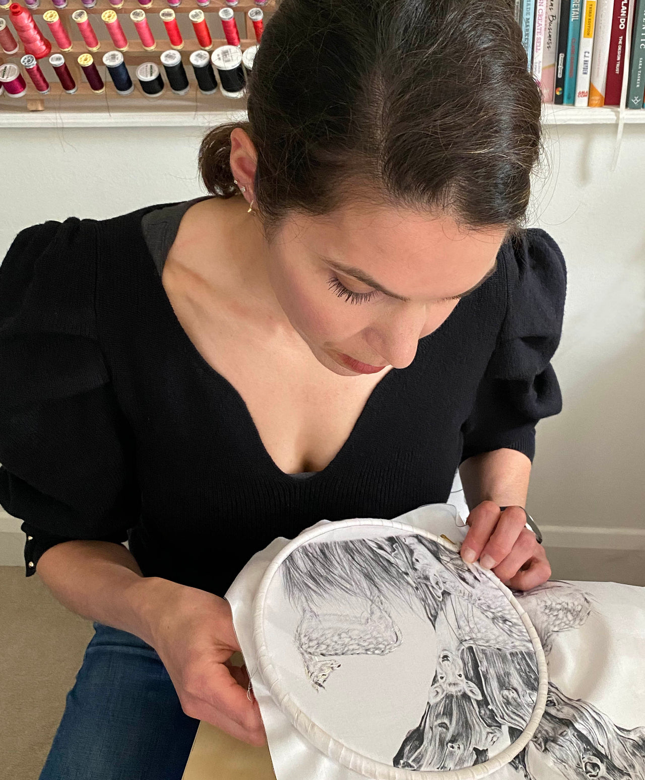 Susannah hand embroidering using a hoop