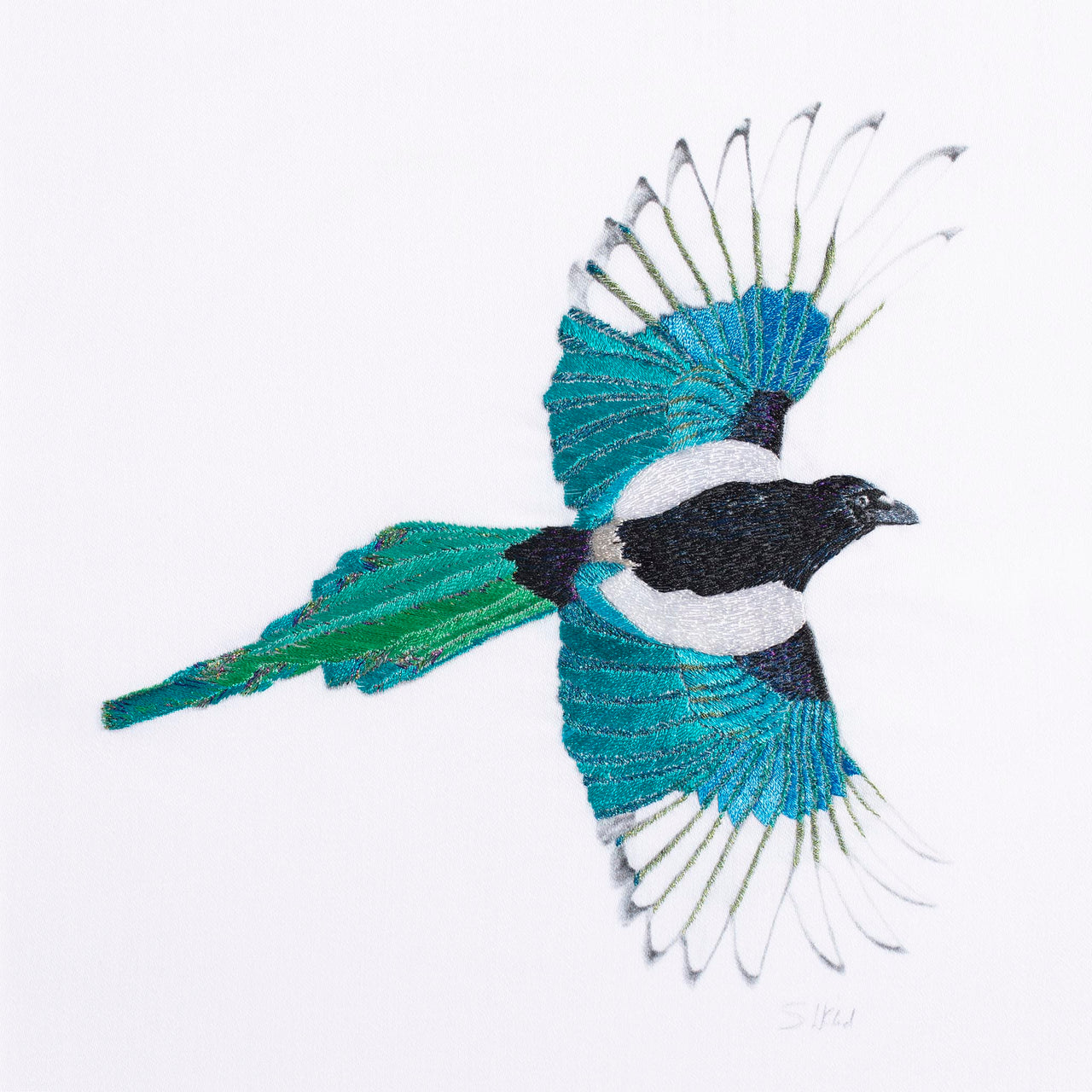 Bushy Magpie limited edition embroidery art print by Susannah Weiland, a close-up showing a magpie with wings fully outstretched, rendered entirely in silk threads in vivid teal, blue and green with black and white, capturing the iridescent beauty of the bird's plumage in flight on a white ground, hand-signed by the artist.