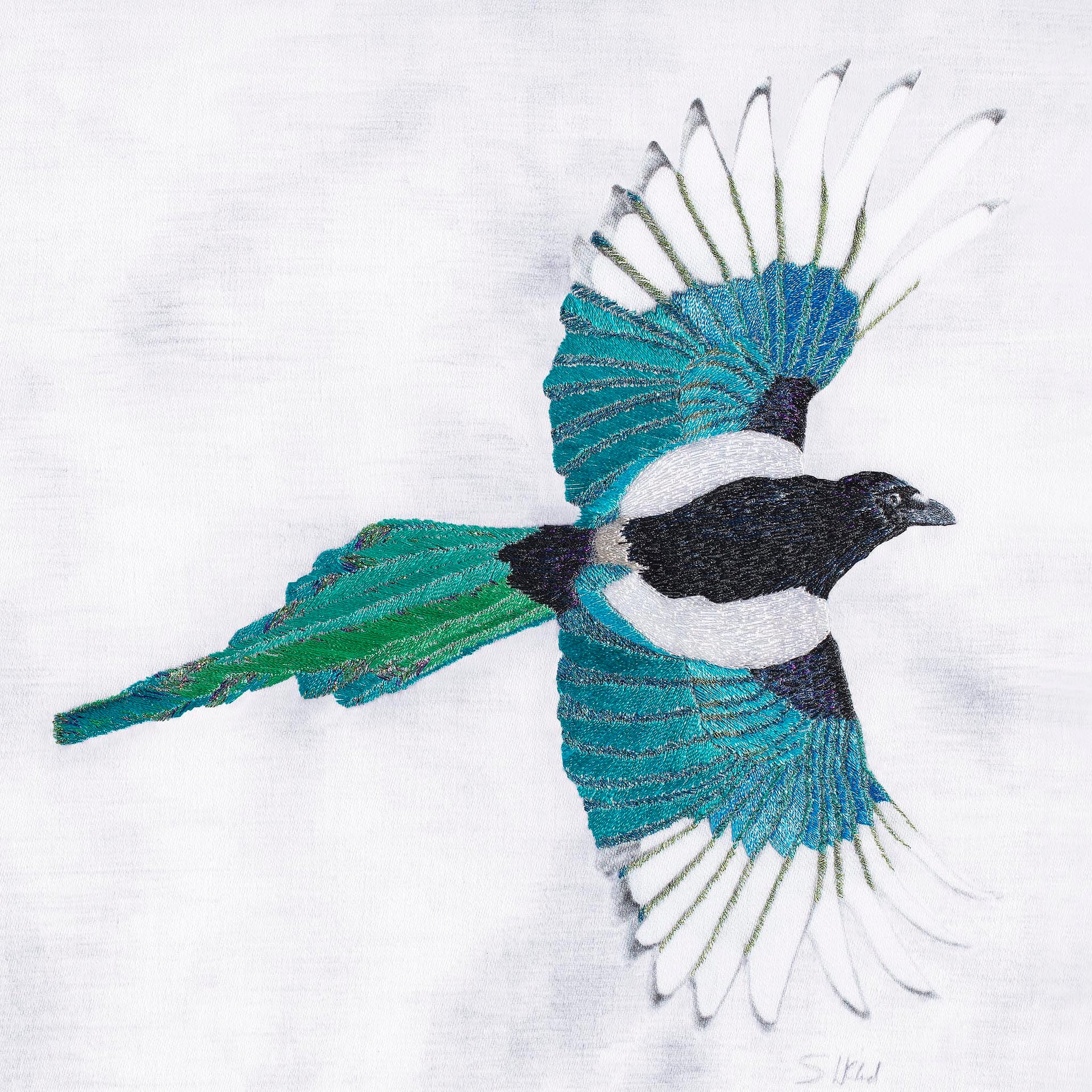 Magpie hand embroidered artwork.