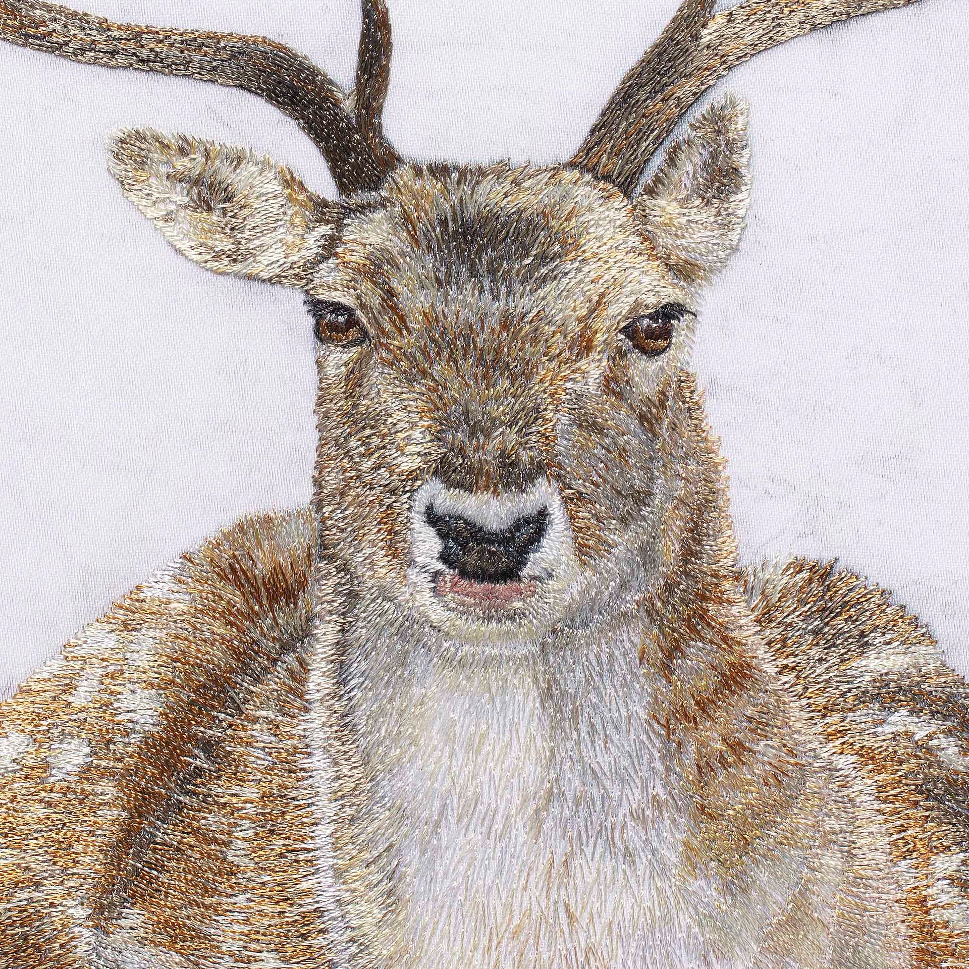 Hand embroidered sitting Deer close up
