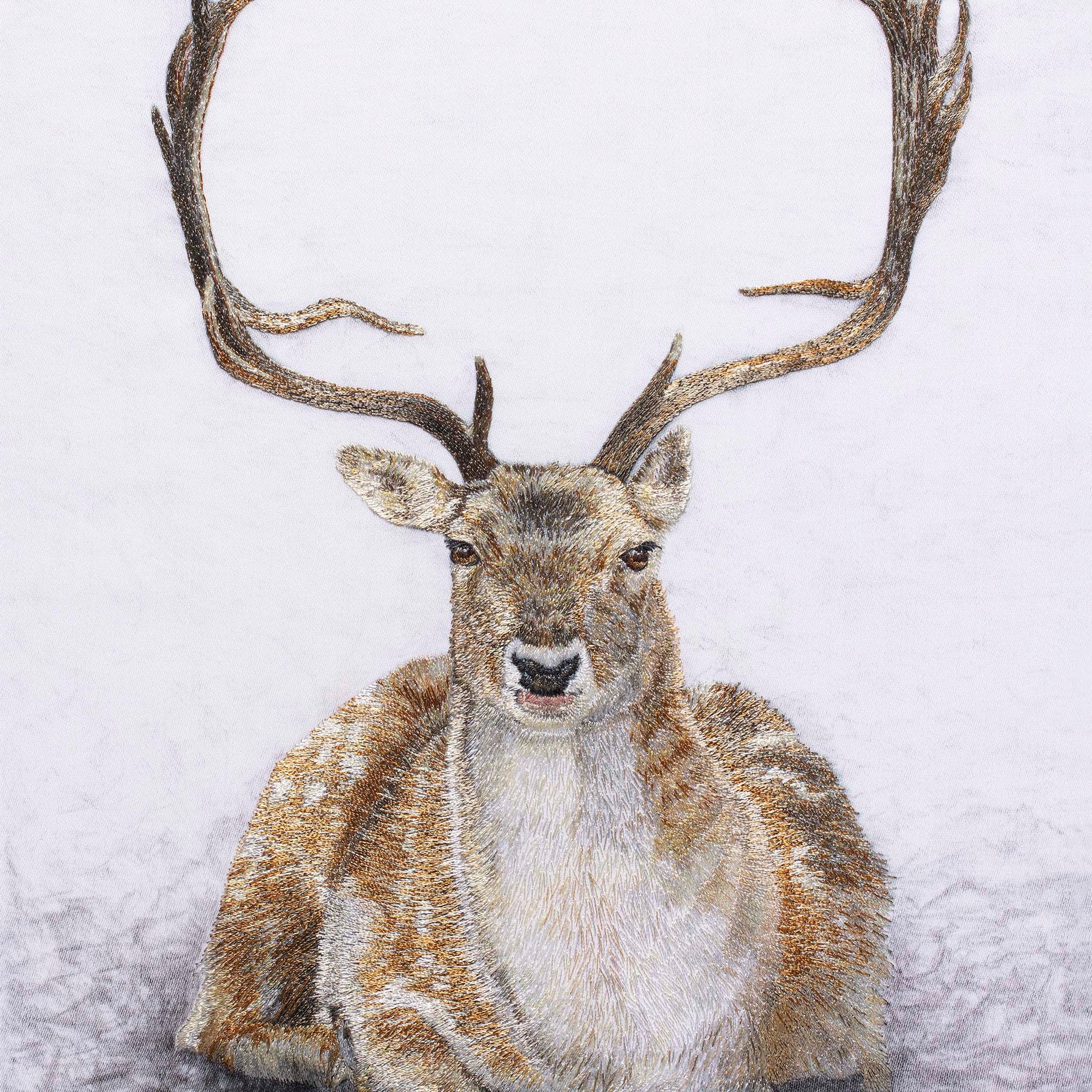 Sitting deer hand embroidered artwork.