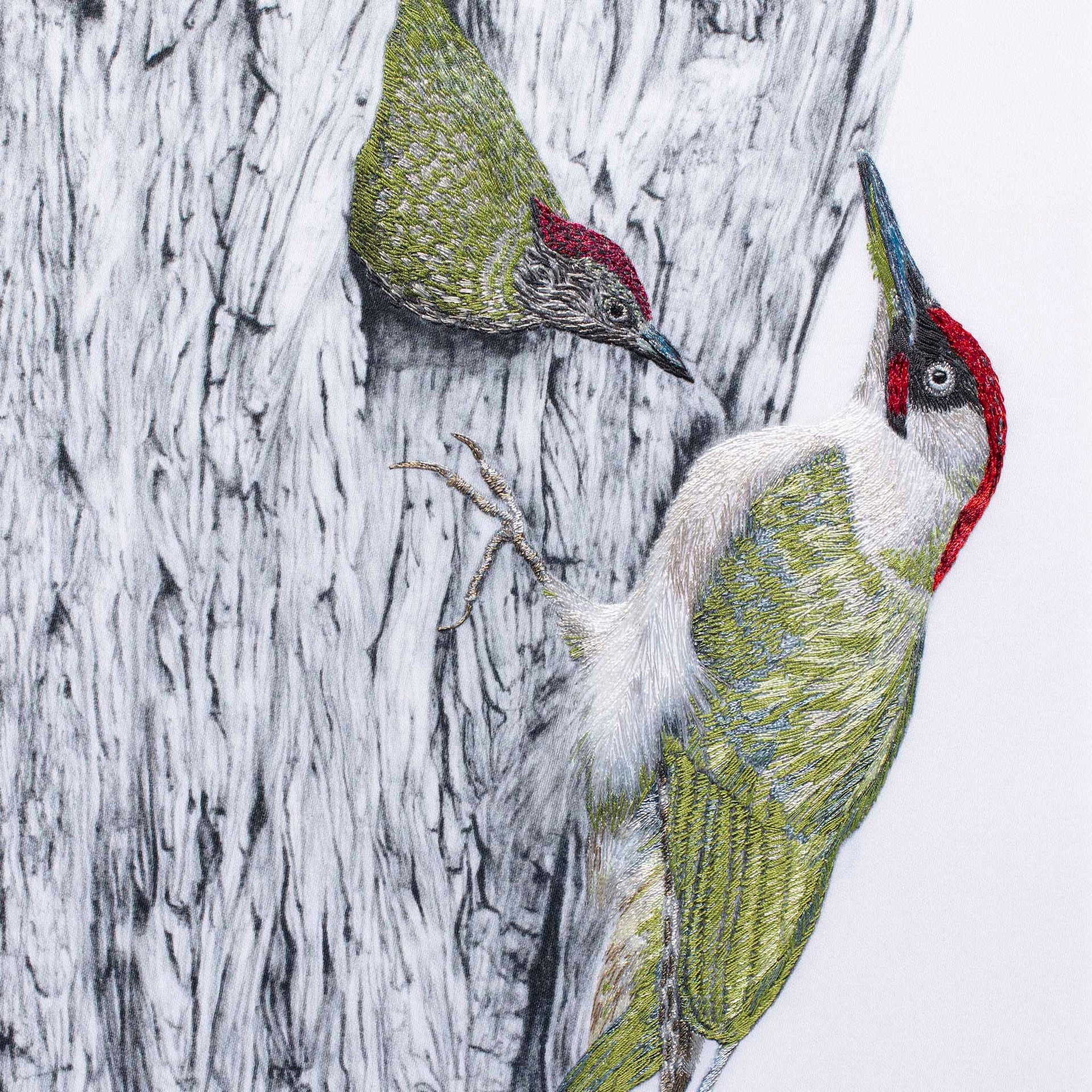 Woodpeckers hand embroidered artwork.
