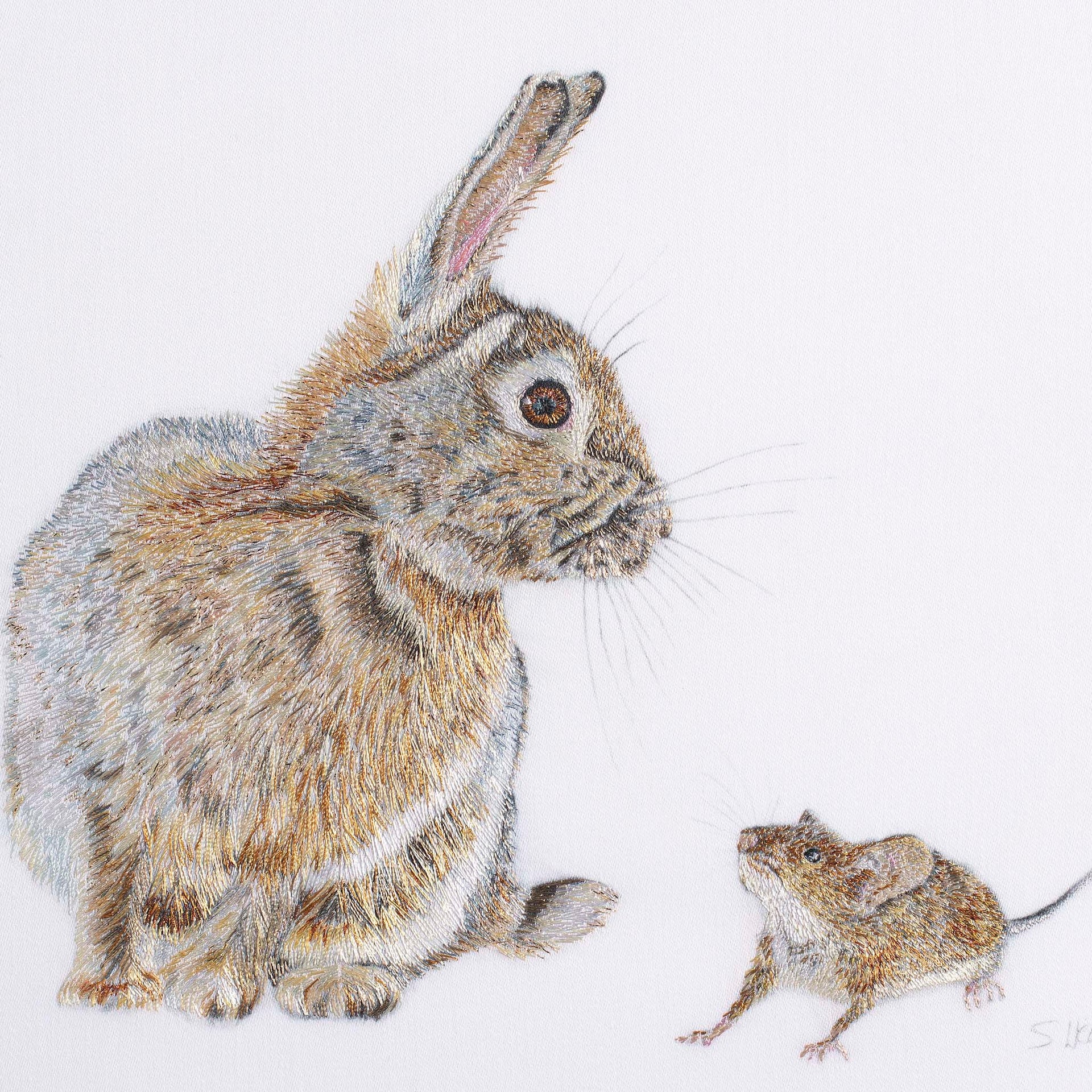 Rabbit and mouse hand embroidered artwork.