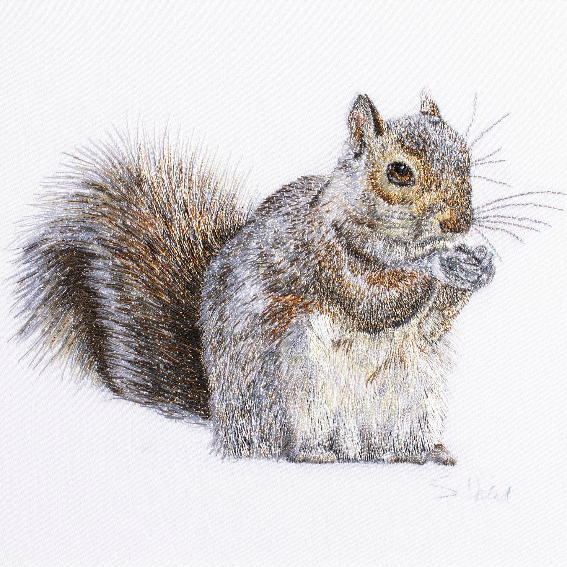 Squirrel hand embroidered artwork.