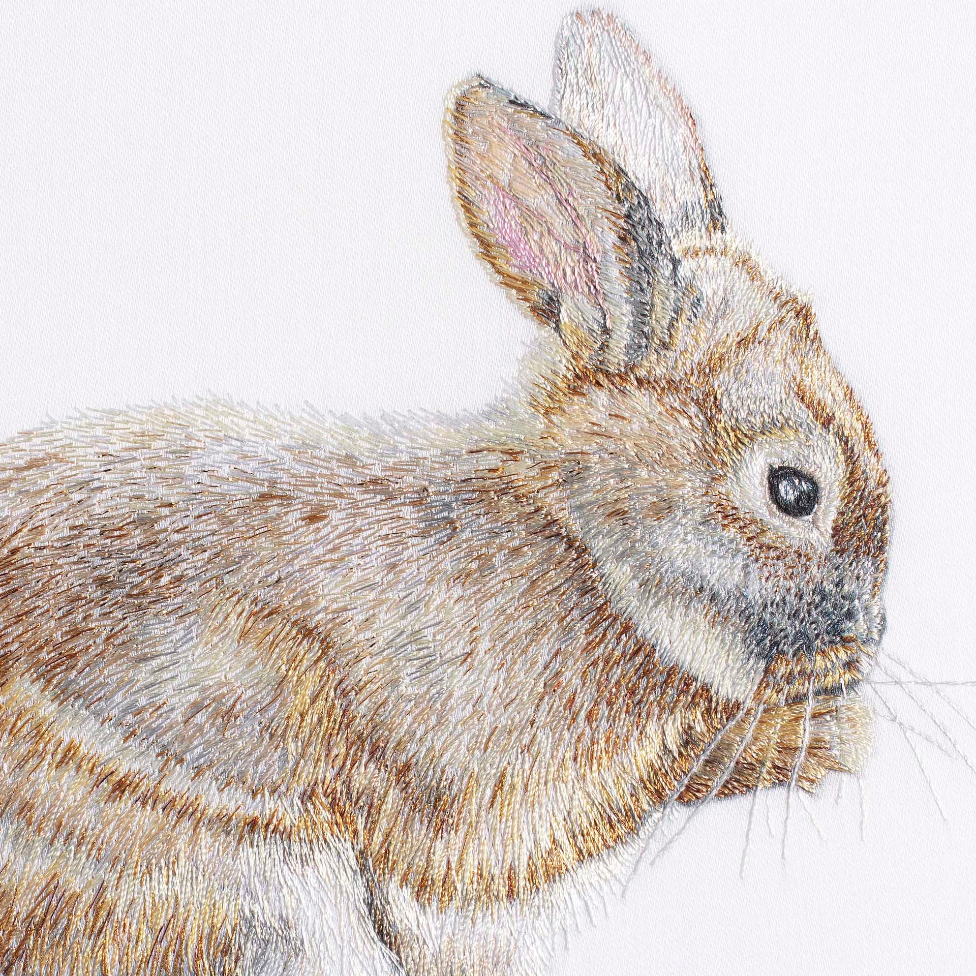 Bunny rabbit hand embroidered wall art close up.