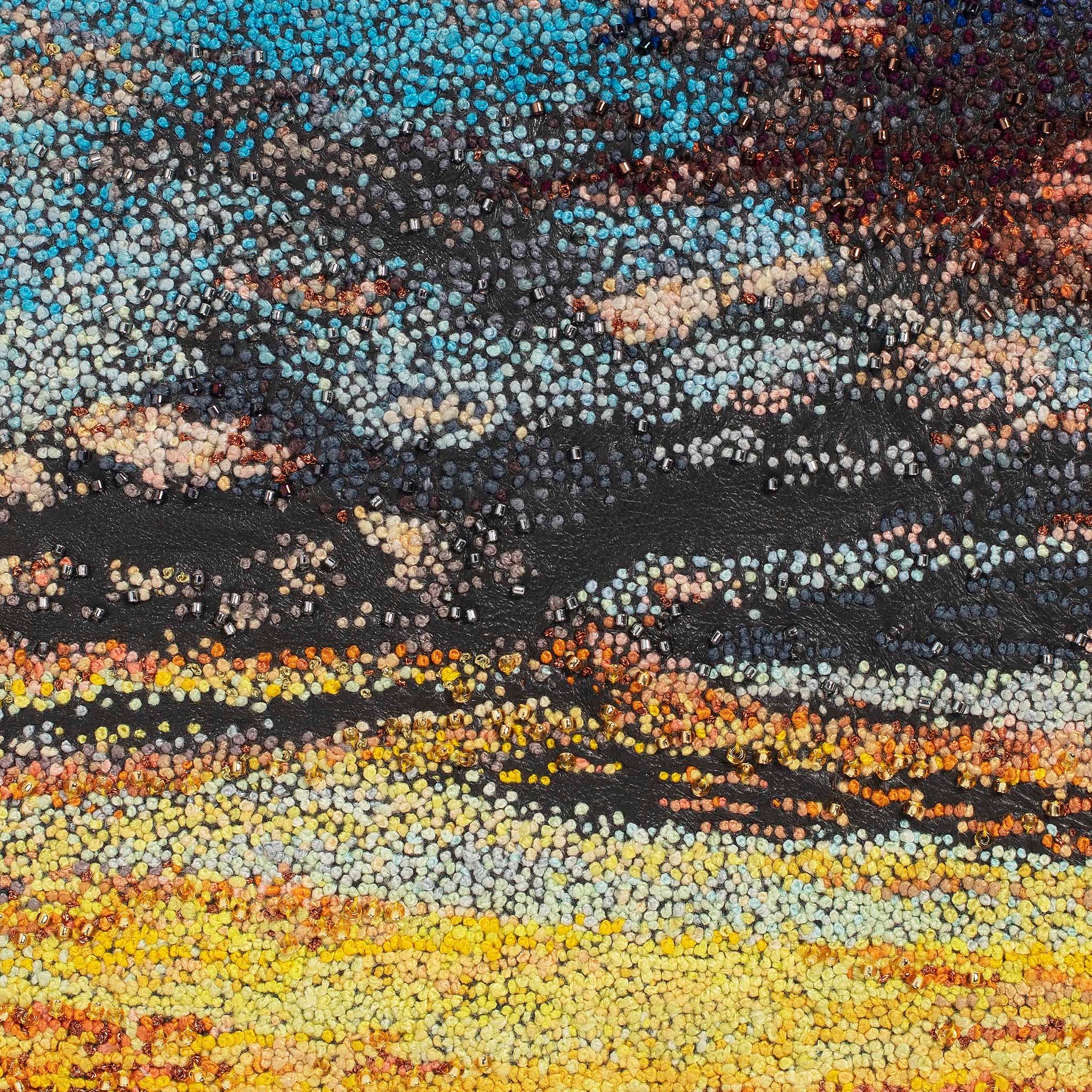 July Sky hand embroidered leather wall art close up.