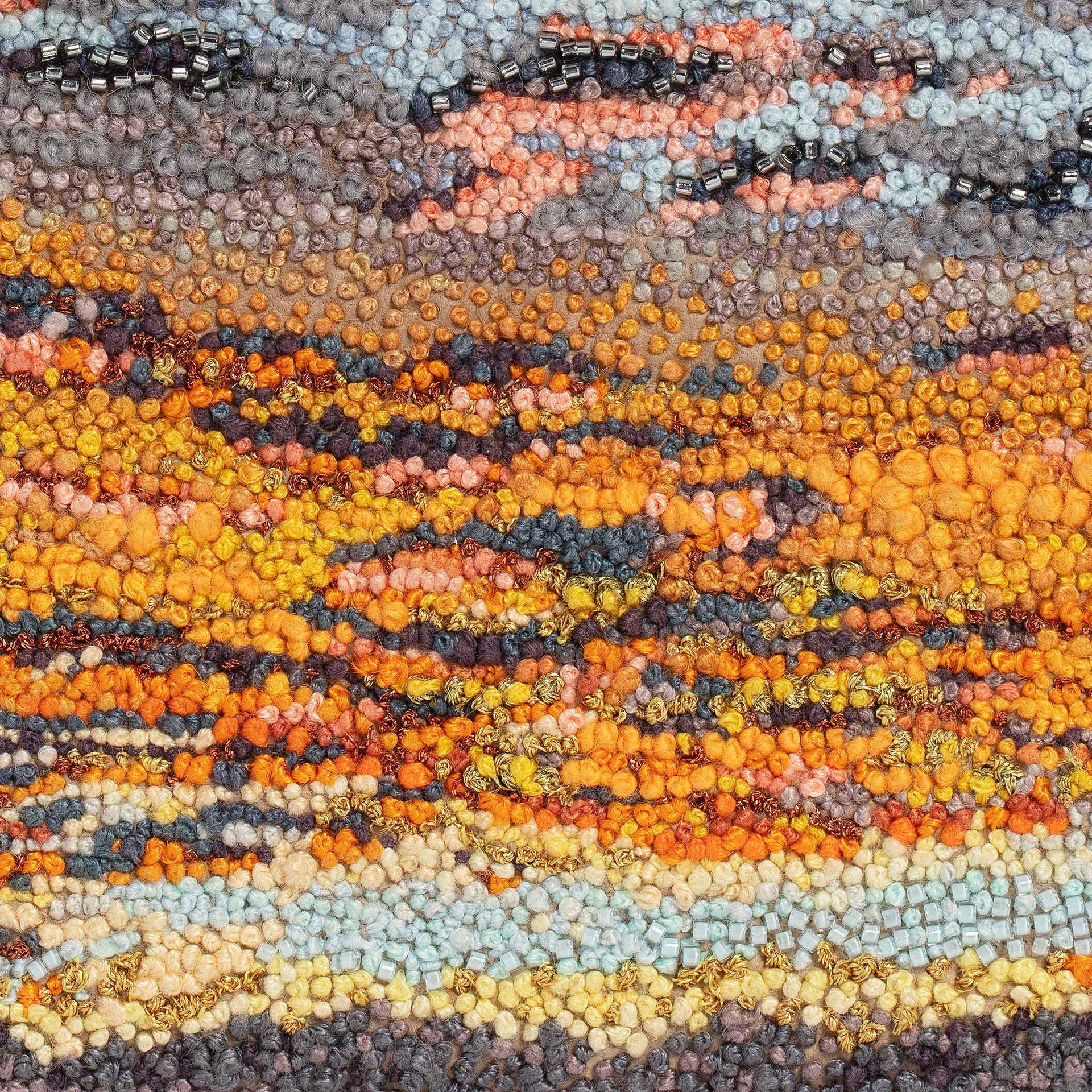 June Sky hand embroidered leather wall art close up.