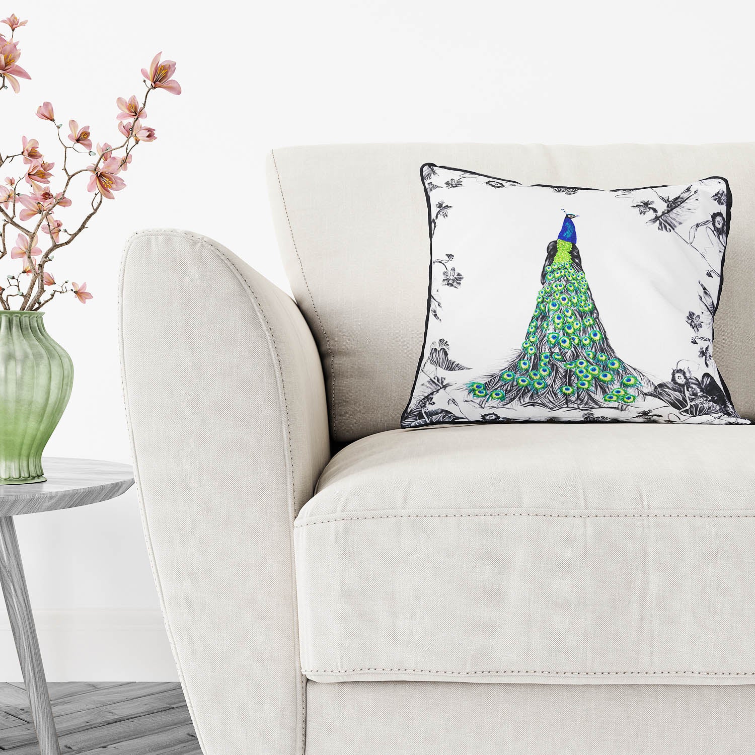 Hand embroidered green peacock cushion on chair 