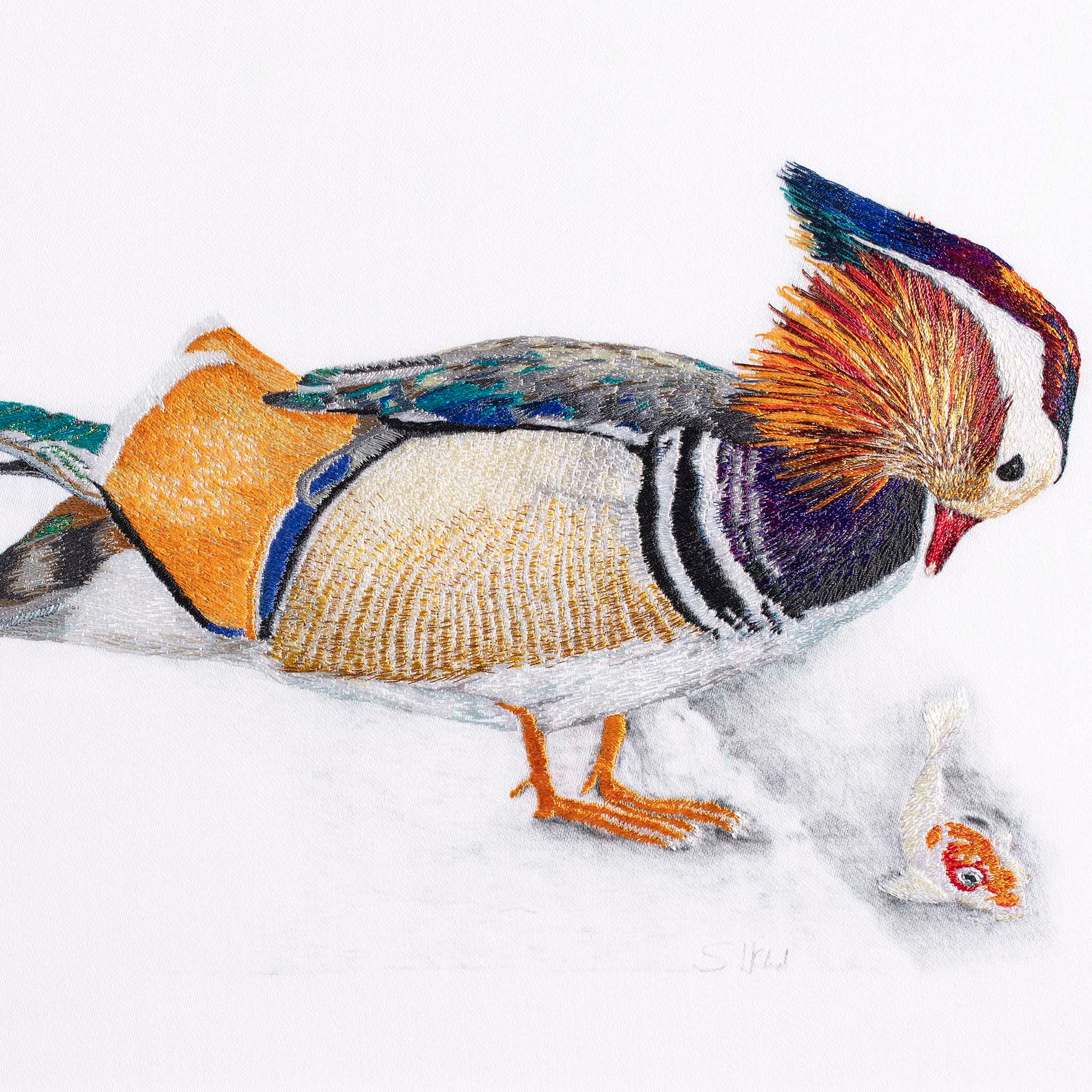 Mandarin duck with fish hand embroidered artwork.