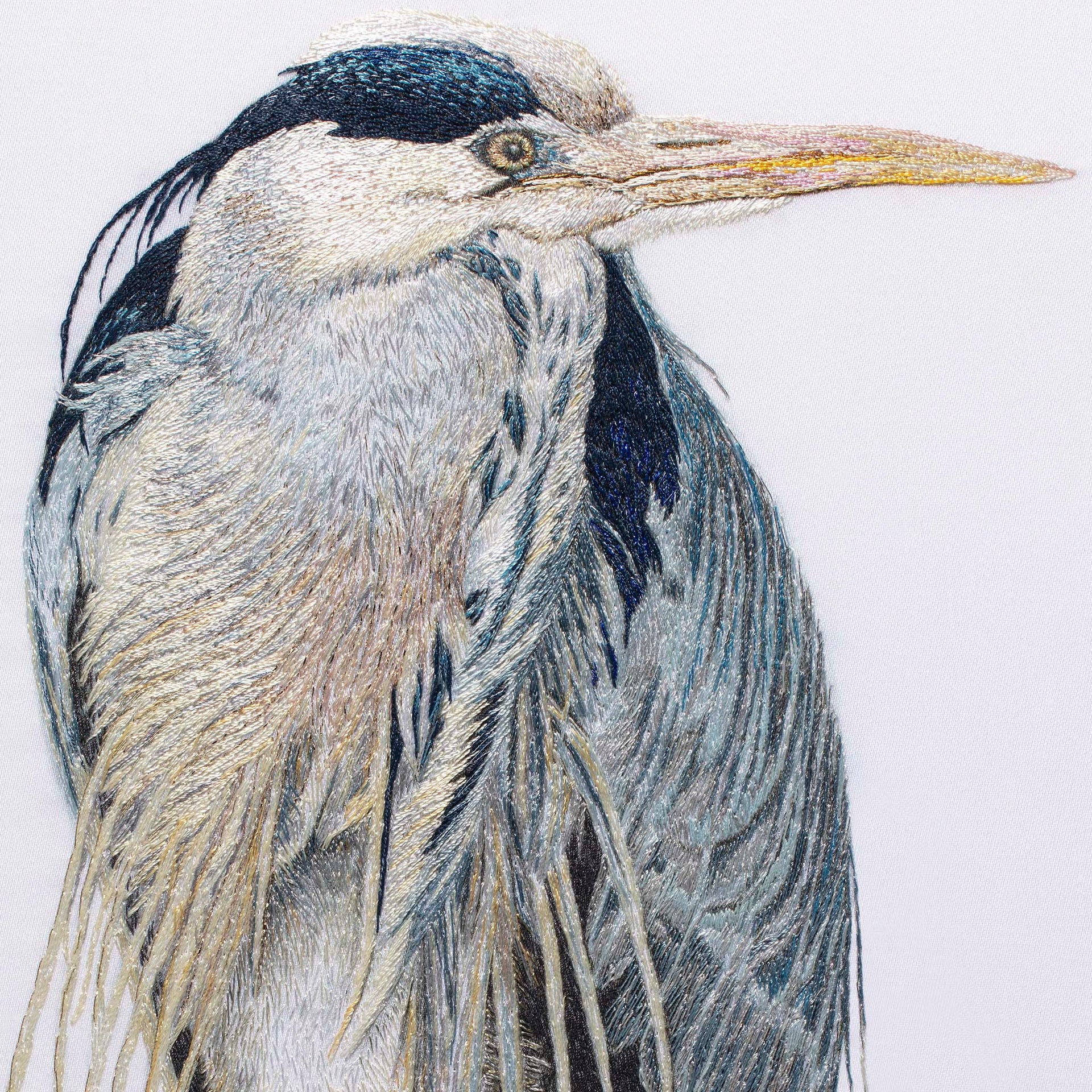 Heron hand embroidered wall art close up.
