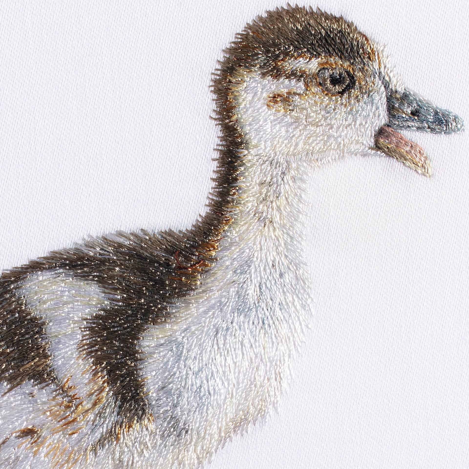 Gosling hand embroidered wall art close up.