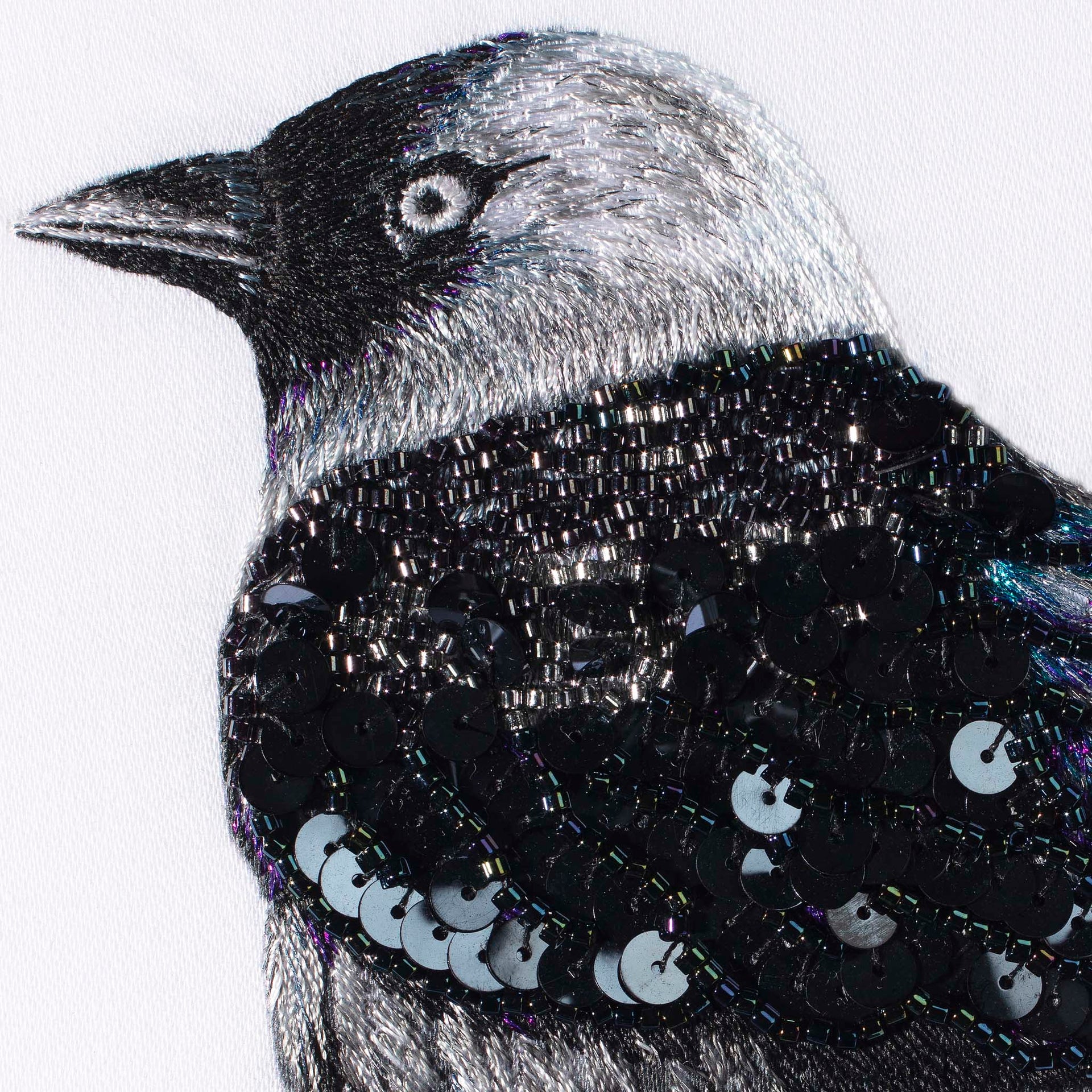 Original hand embroidered, bead and sequinned bird artwork close up