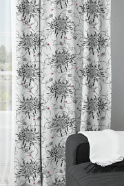 Floral chrysanthemums and ladybird fabric curtains.