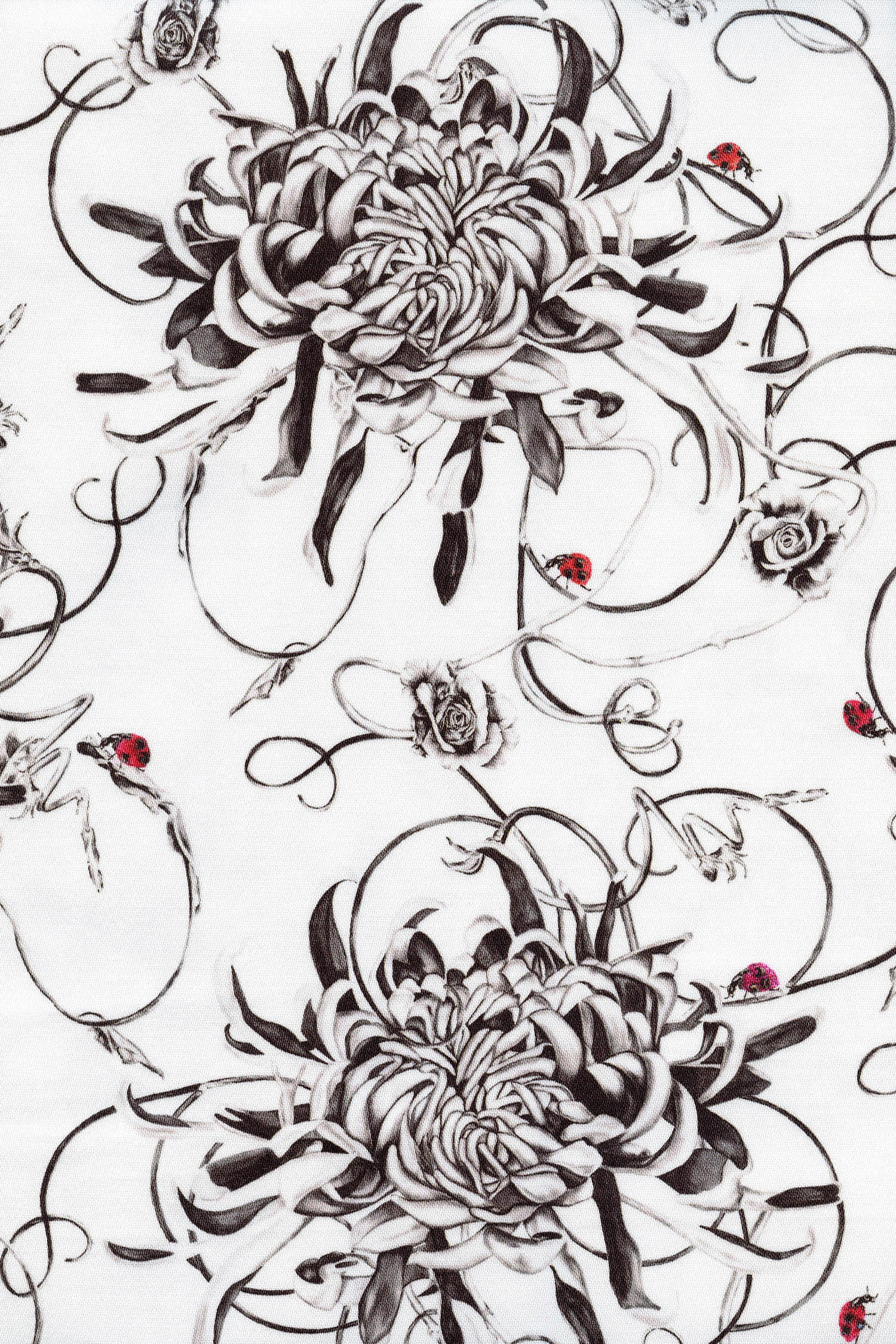 Floral chrysanthemums and ladybird fabric close up.