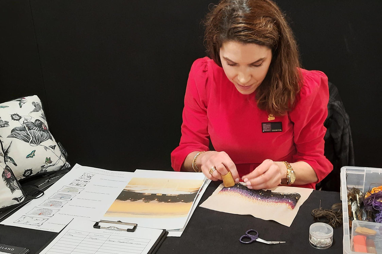 Susannah Weiland hand embroidering at the Fine Art Fair