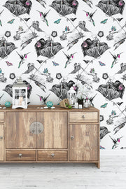 Pink hummingbirds wallpaper on hallway wall.