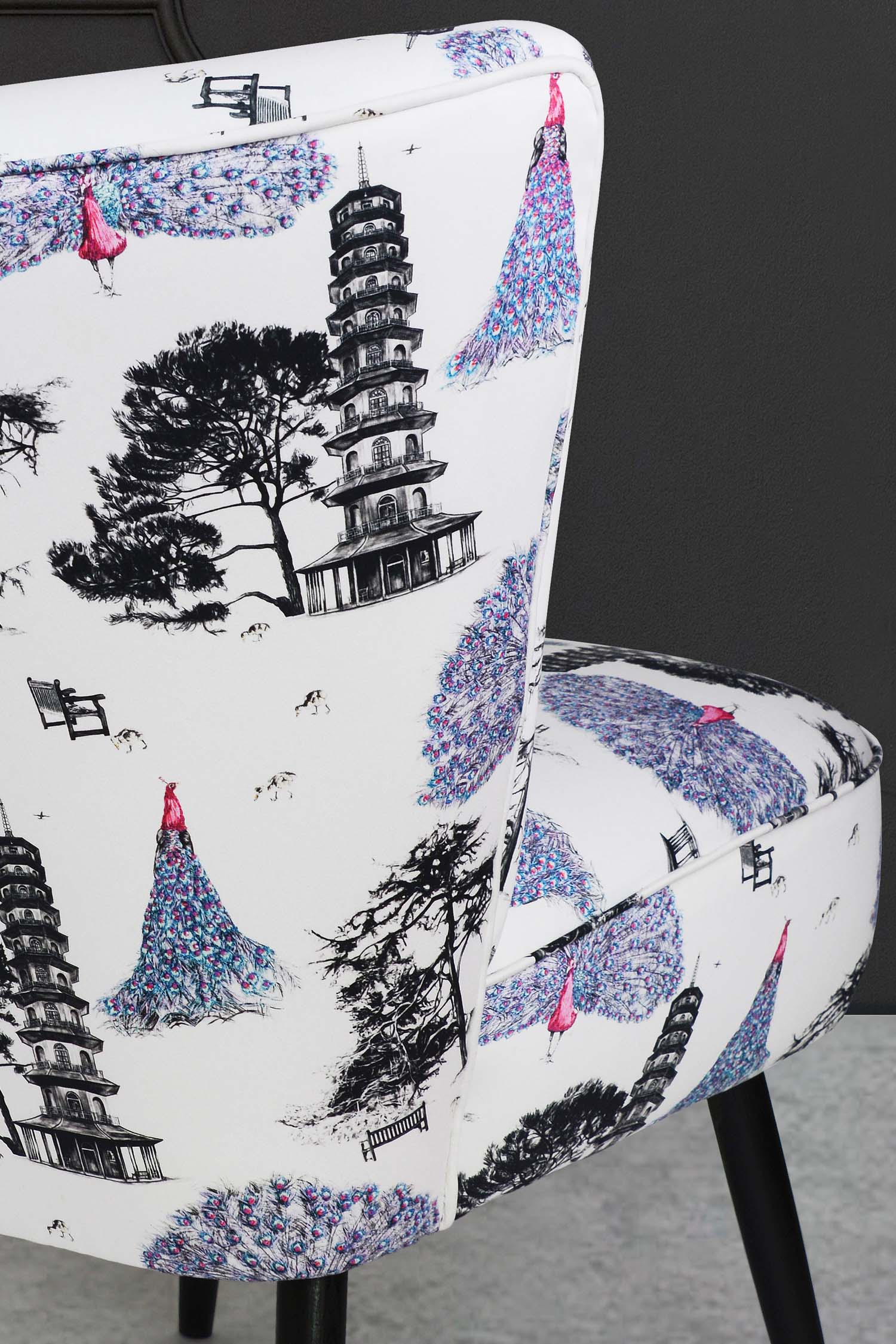 Cocktail chair upholstered in pink kew peacocks fabric.