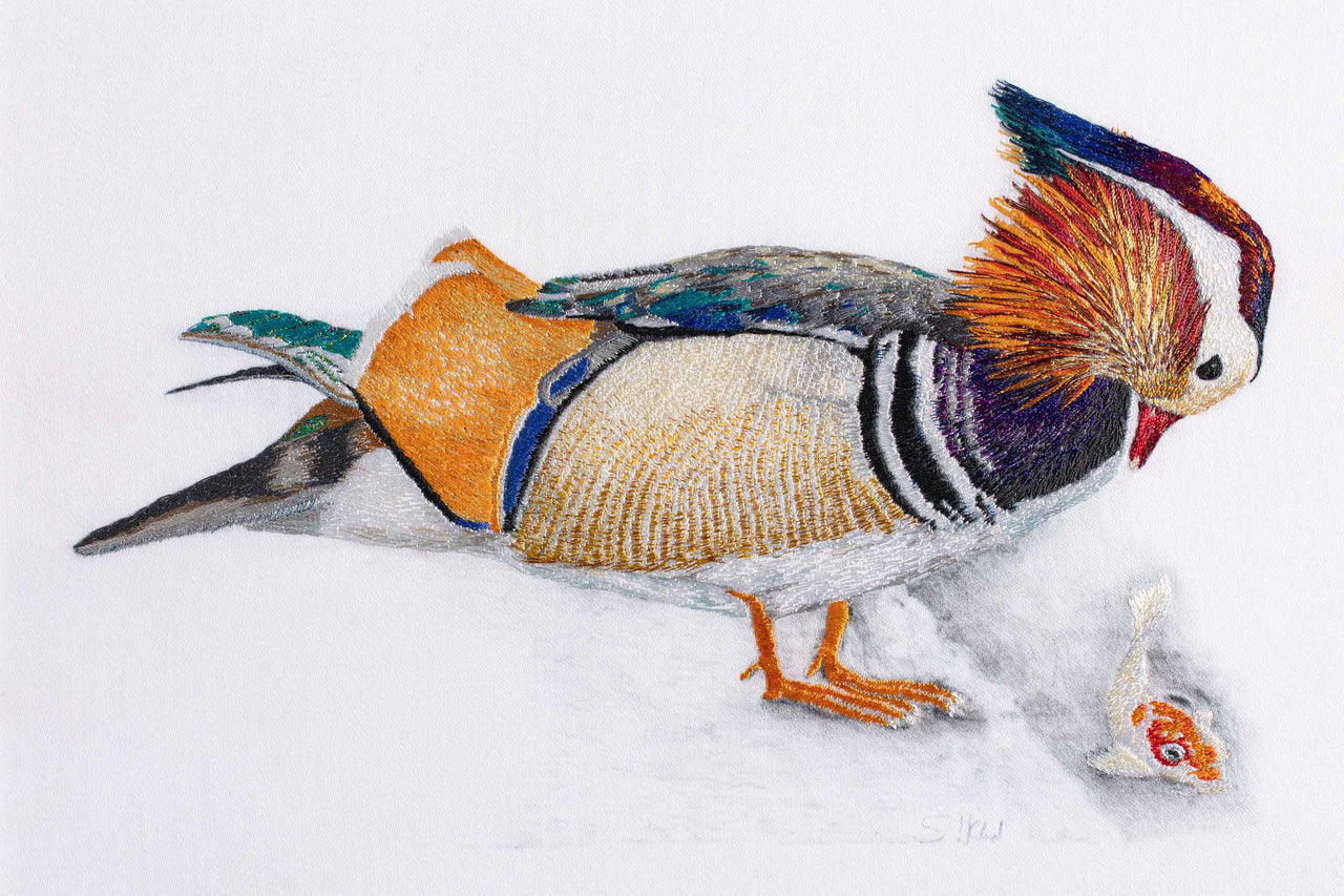 Mandarin duck with fish hand embroidered wall art.