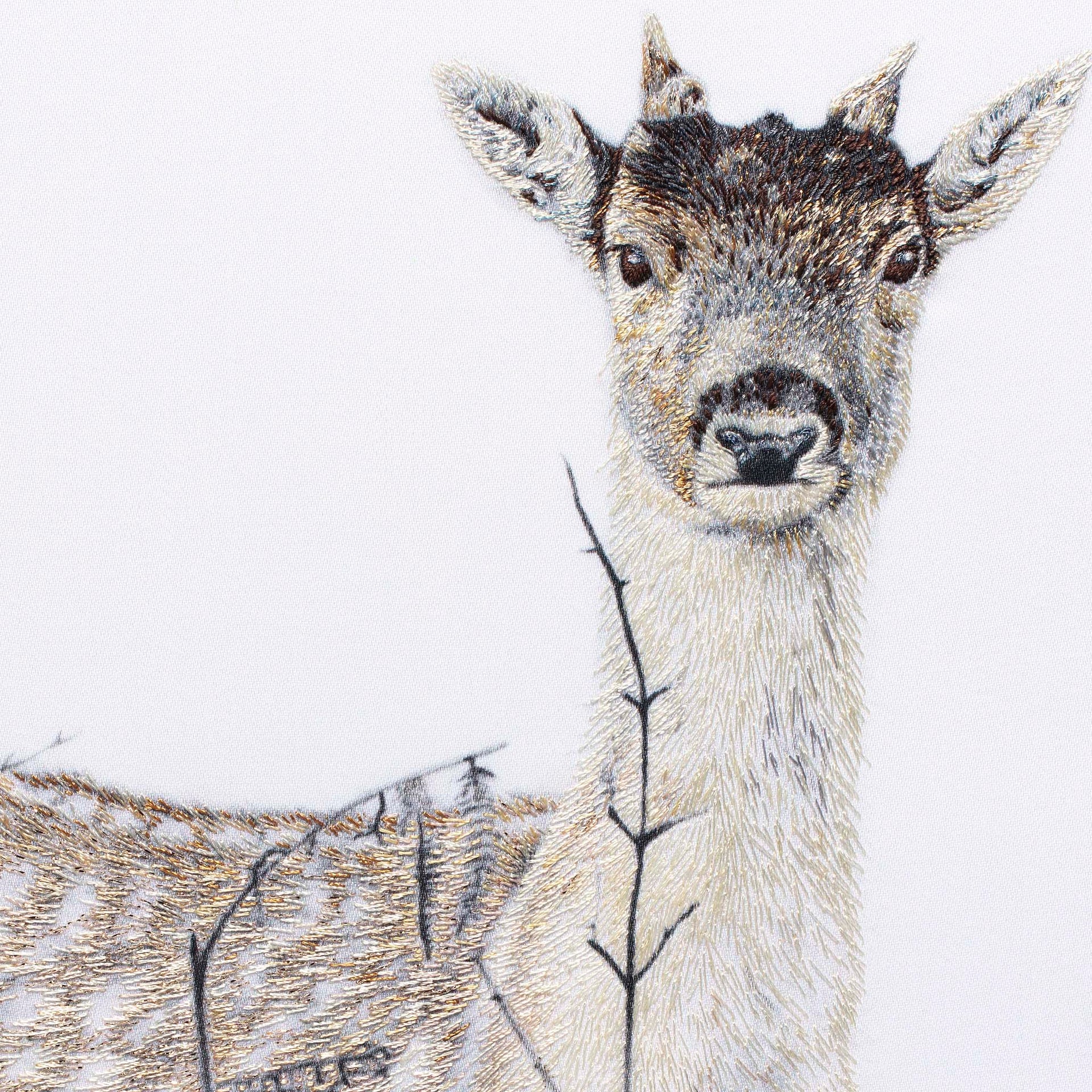 Deer hand embroidered wall art close up.