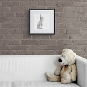 Bunny rabbit pencil drawing print in frame on wall