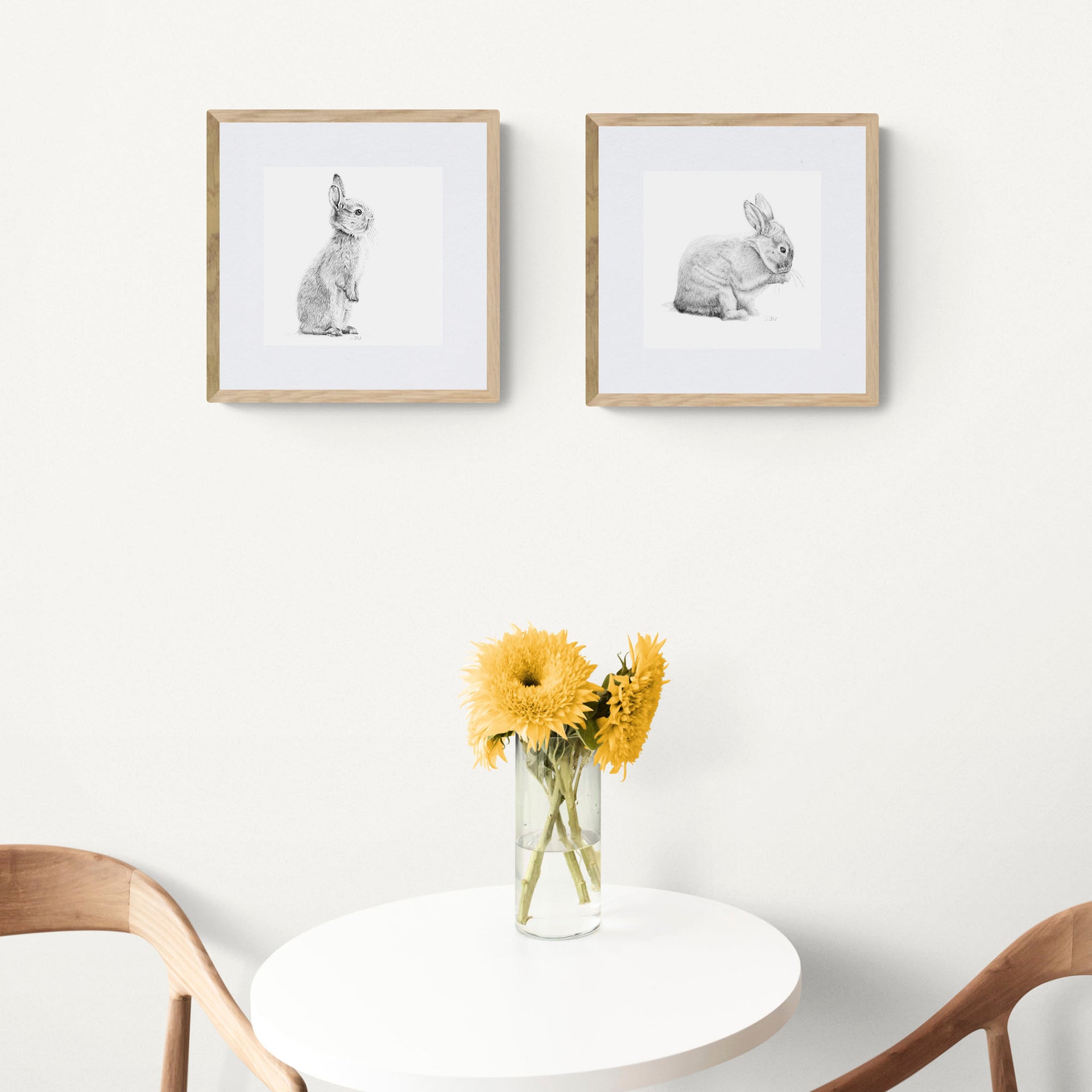 Two rabbit pencil drawing prints on wall