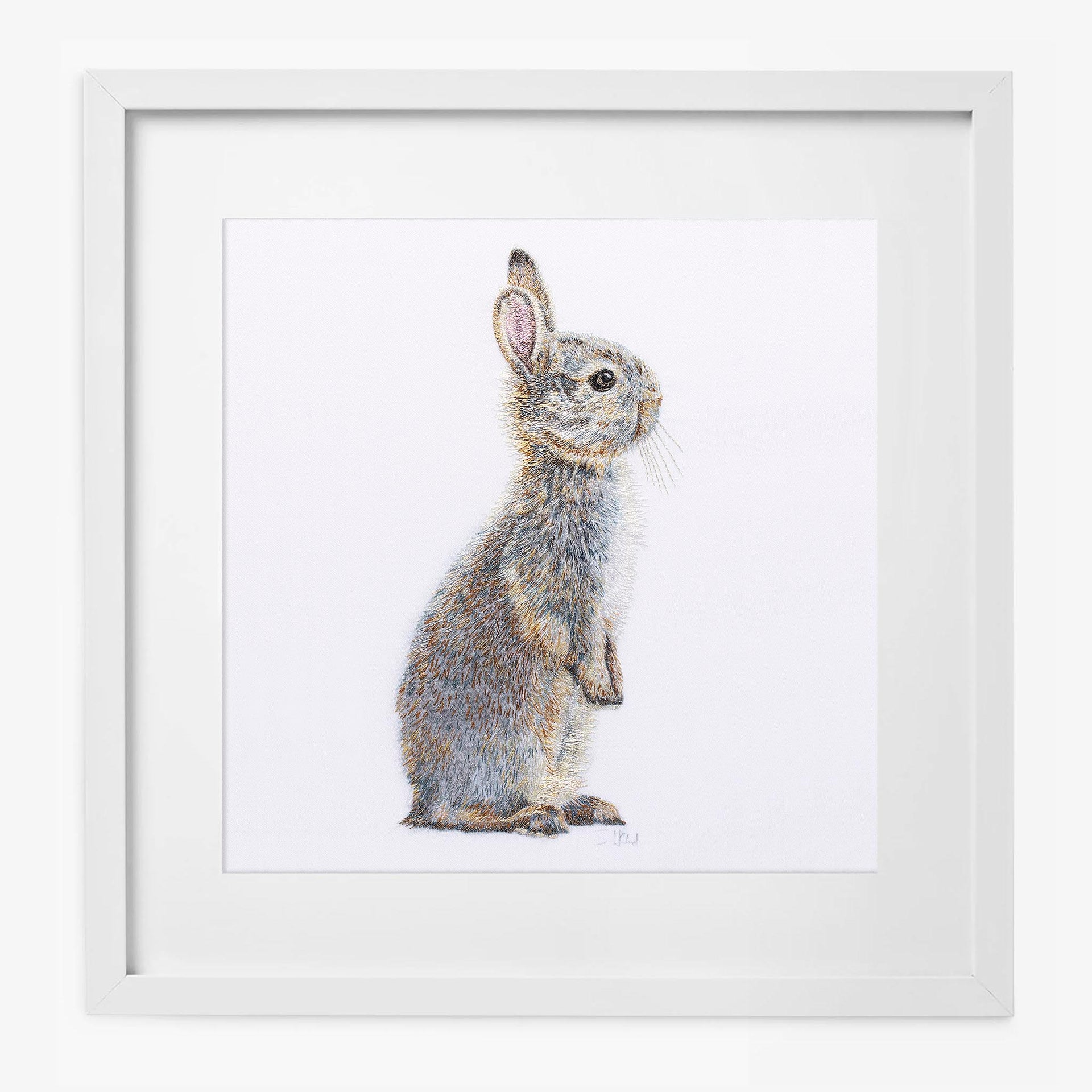 Hand embroidered bunny print in white frame
