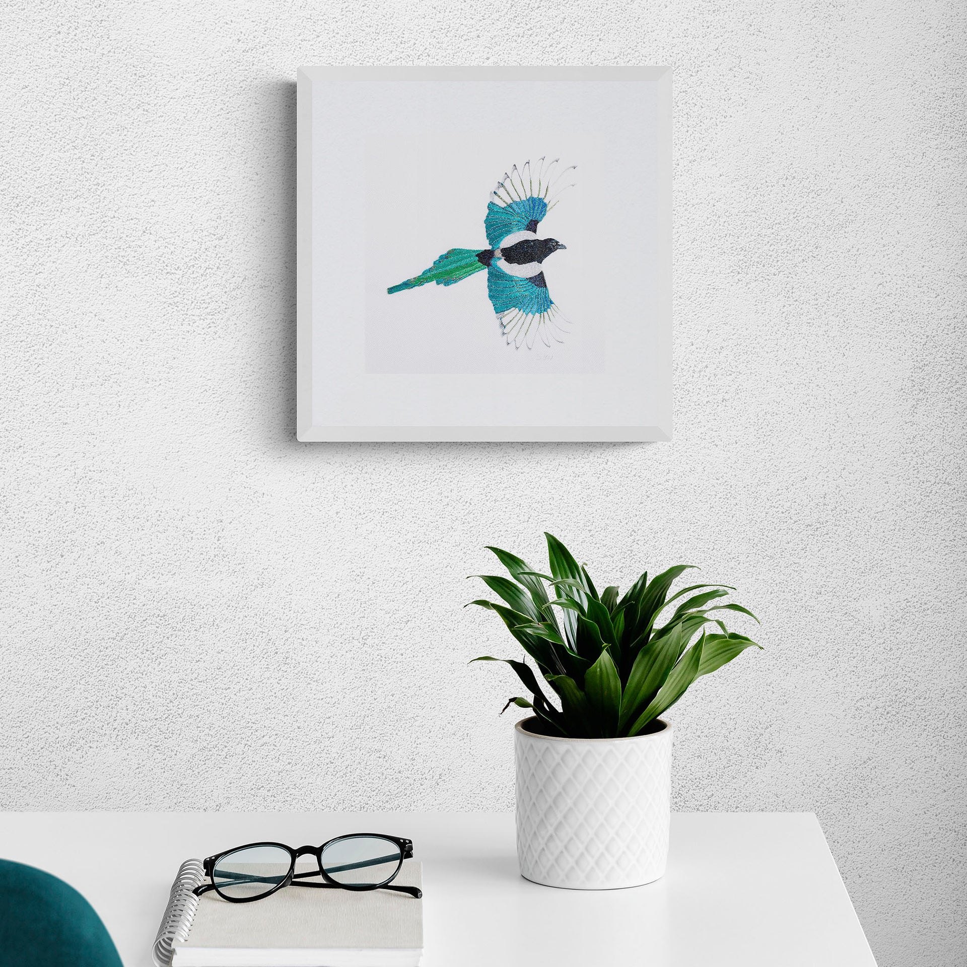 Hand embroidered flying magpie limited edition print on wall