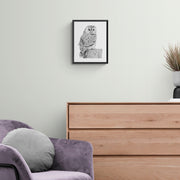 Owl pencil drawing print in black frame on wall