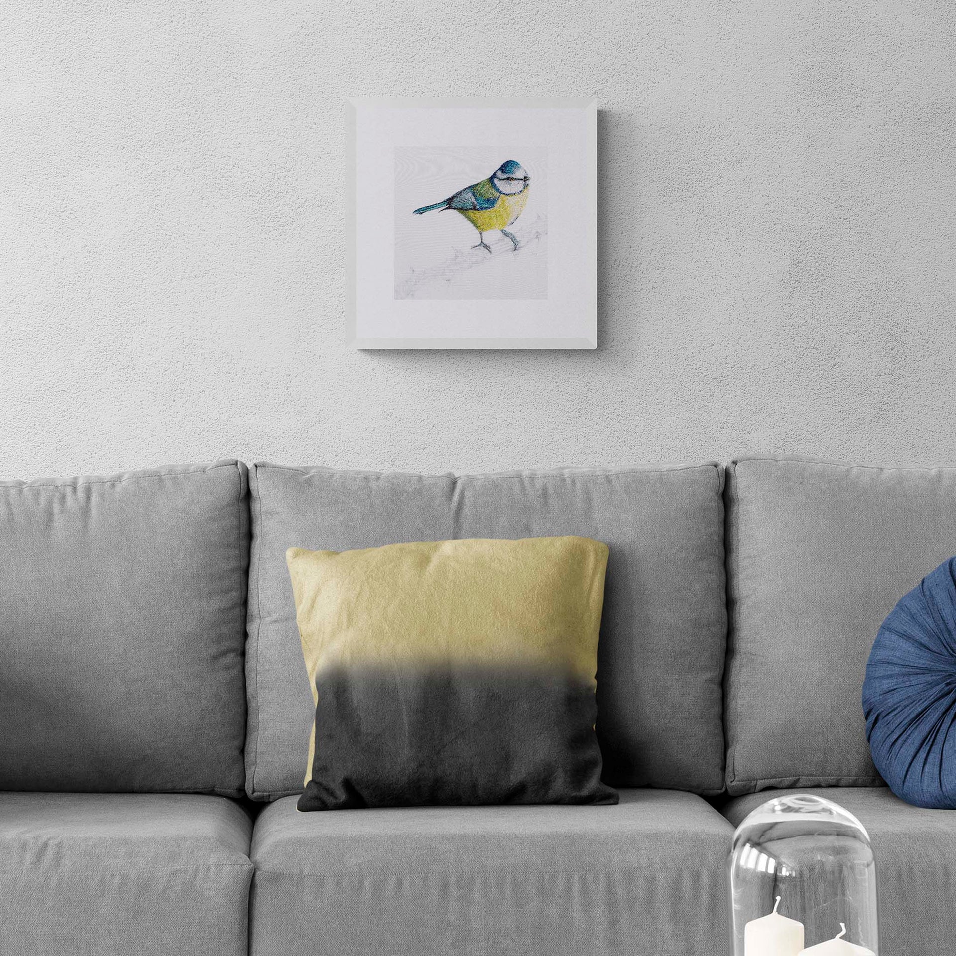 Blue tit hand embroidery limited edition print in white frame on the wall