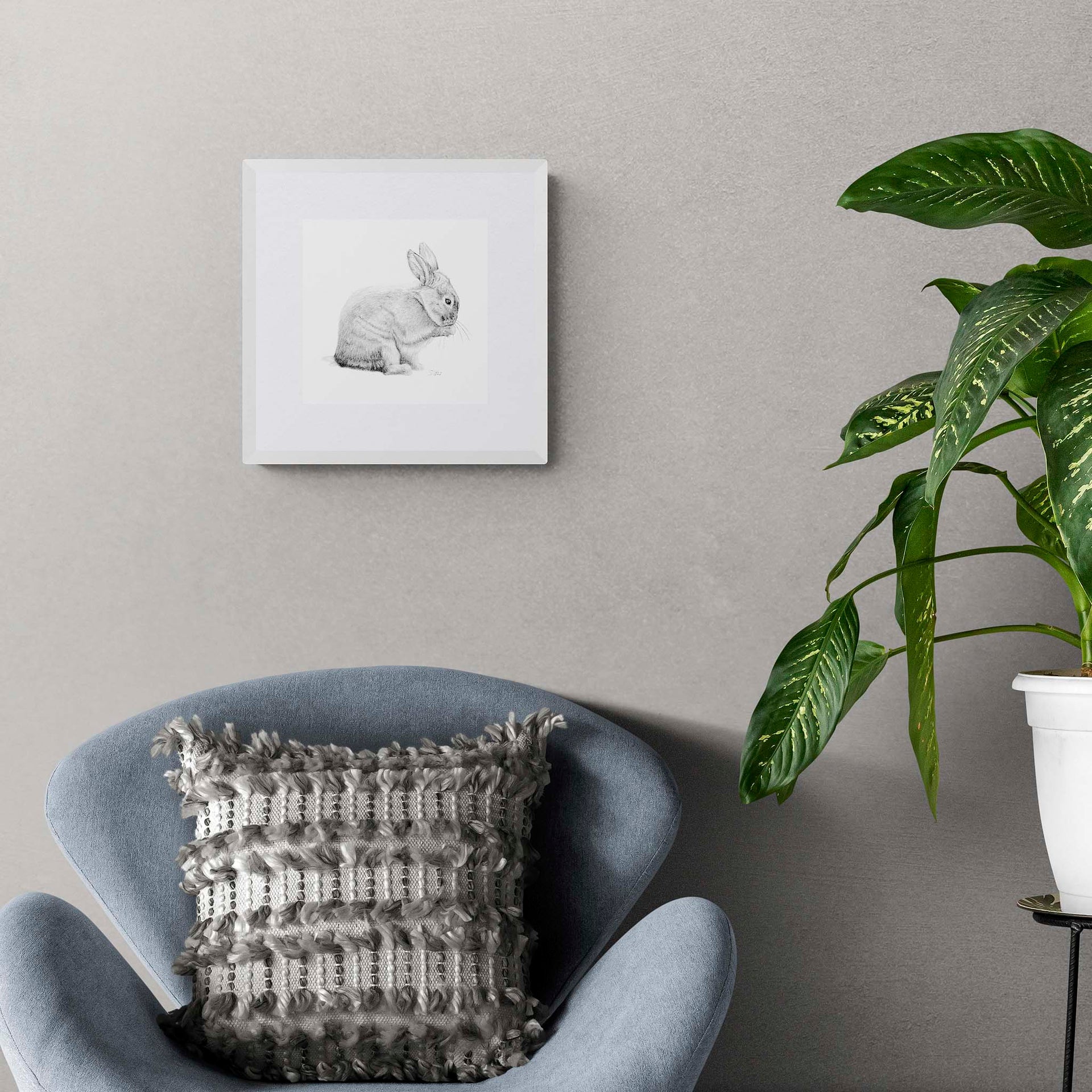 Giclée print of bunny pencil drawing in  frame on the wall