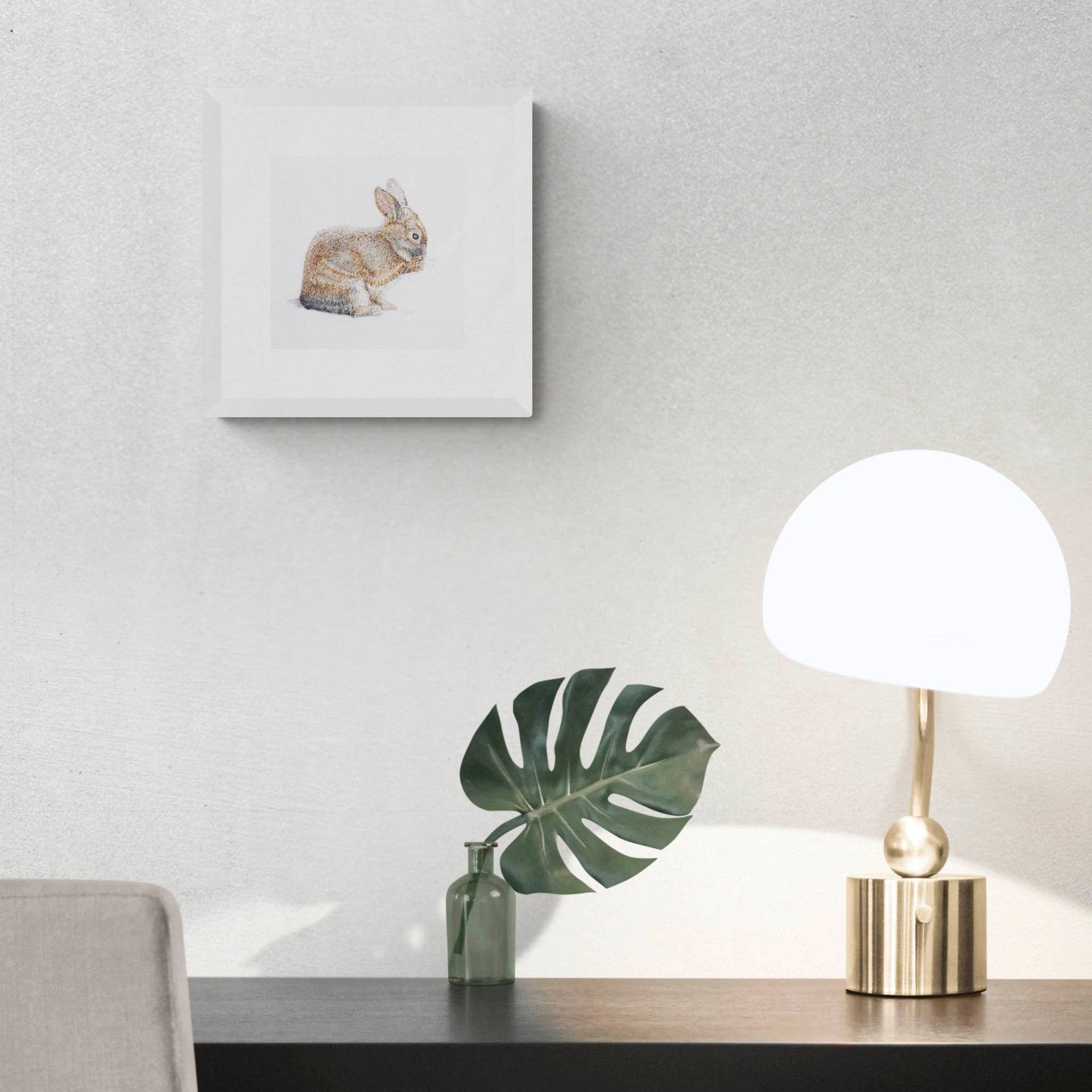 Hand embroidered bunny limited edition print in frame on the wall