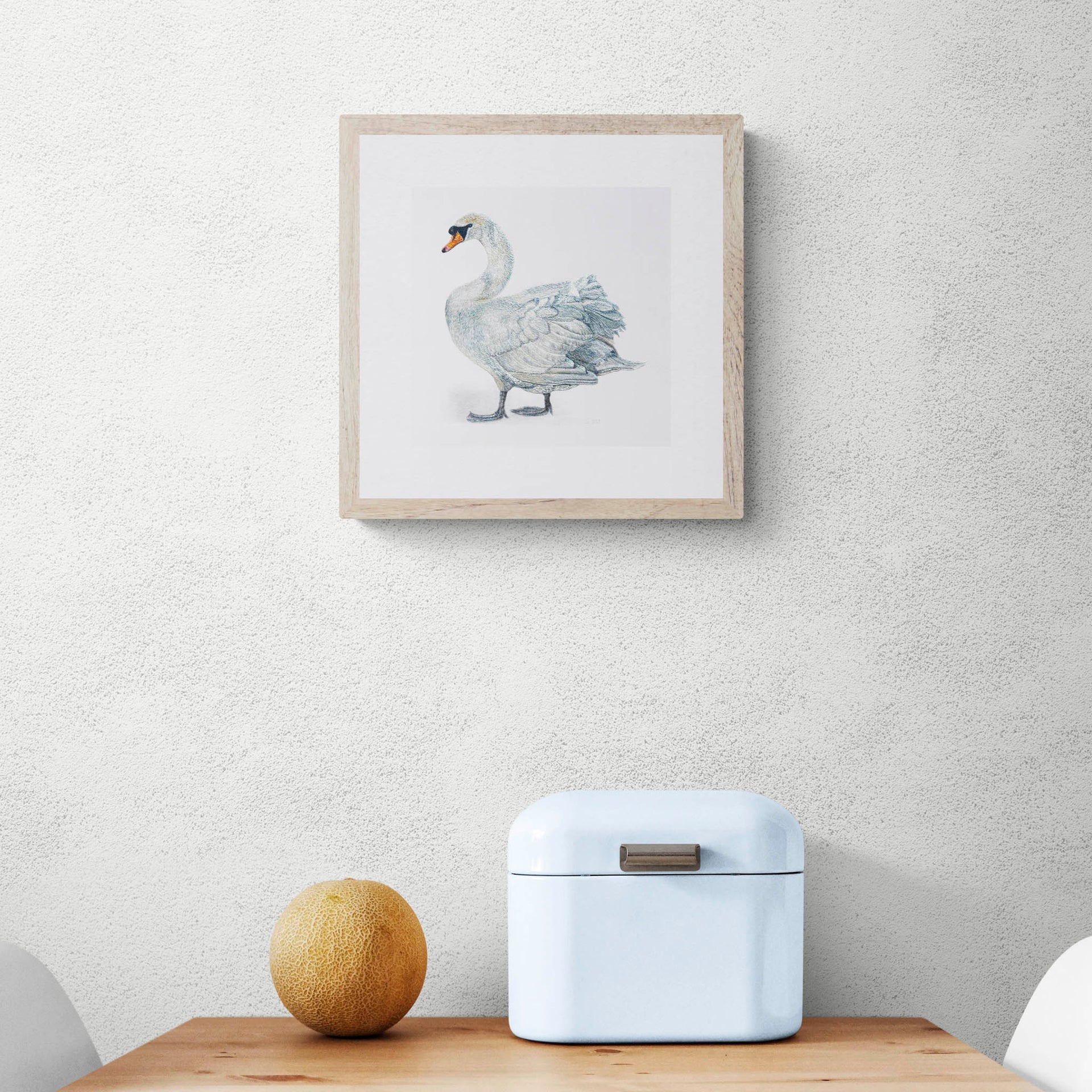 Swan hand embroidered limited edition print in frame on the wall