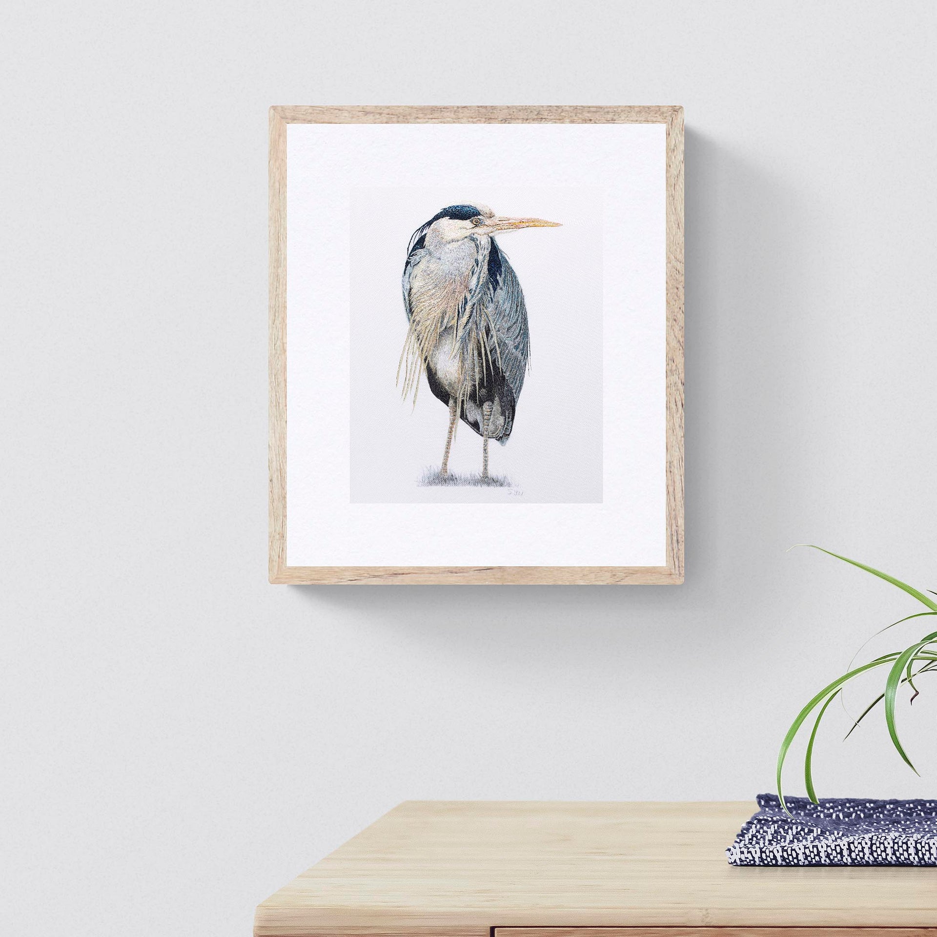 Heron hand embroidered limited edition print in frame on the wall