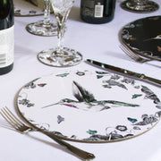 White hummingbird placemat on table setting