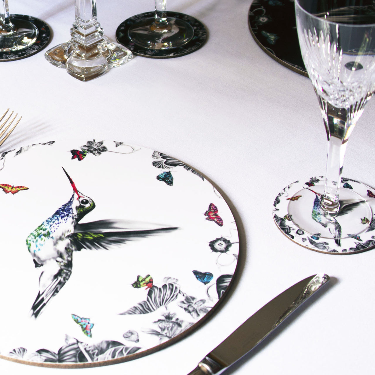 White hummingbird placemat on table