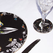 Black hummingbird coaster on table