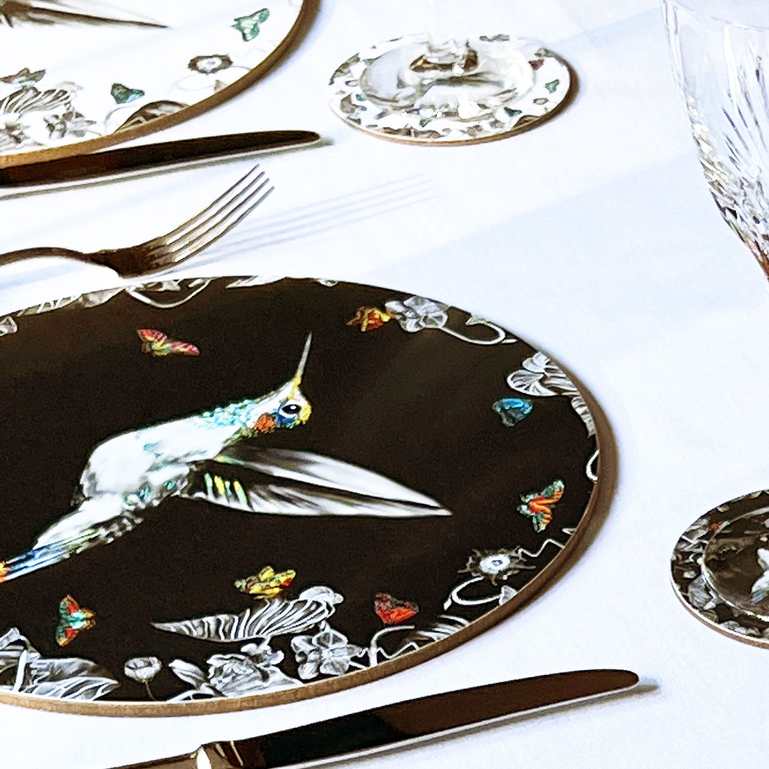 Black hummingbird placemat in table setting