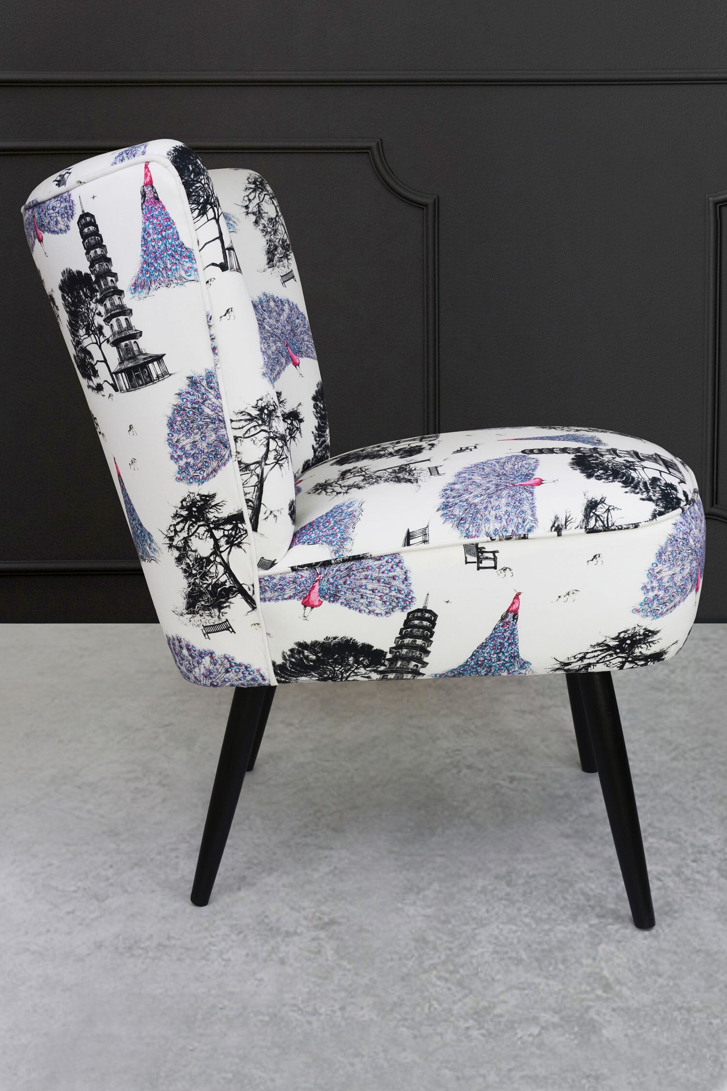 cocktail chair with pink peacocks fabric side view