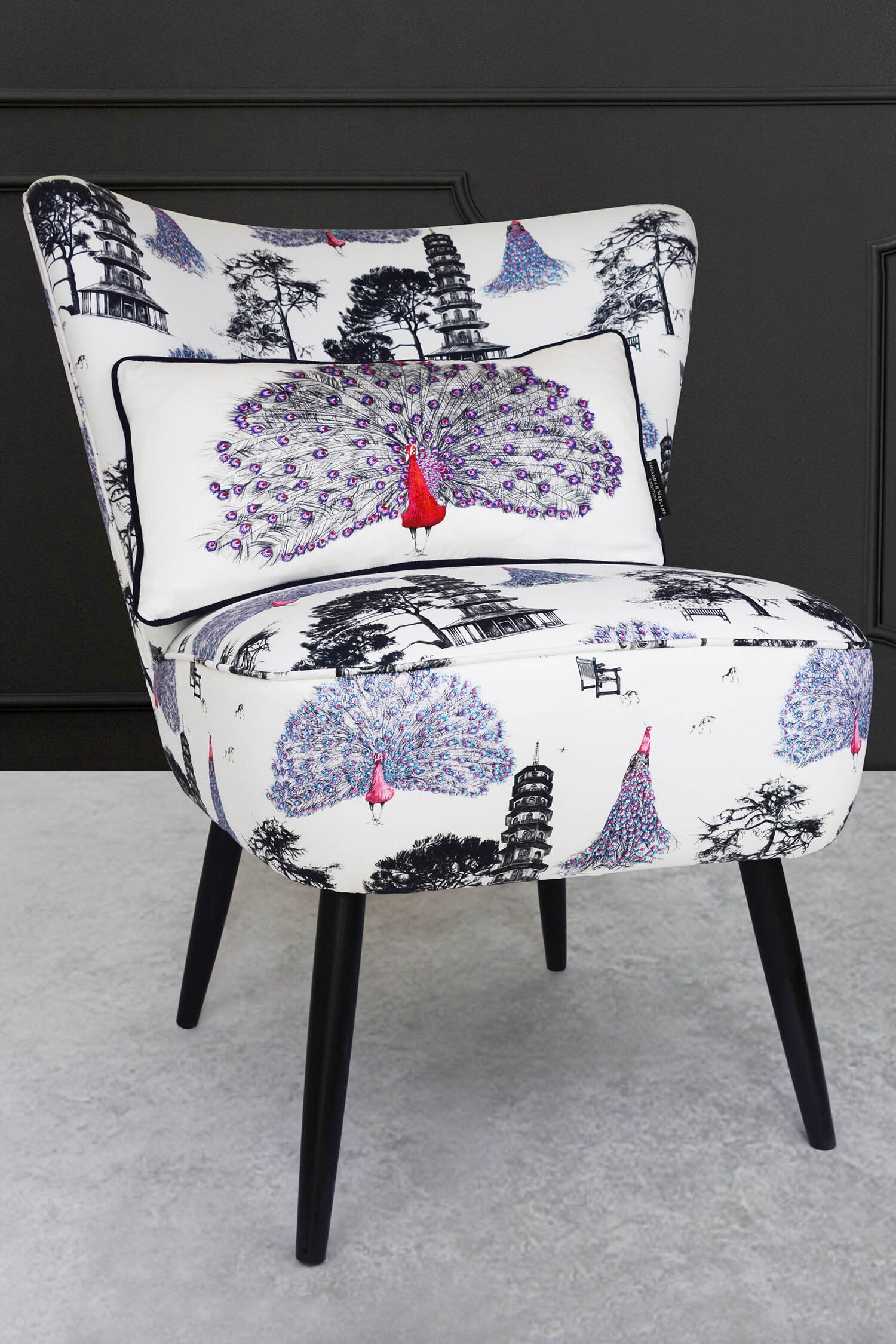 cocktail chair with pink peacocks fabric and peacock cushion