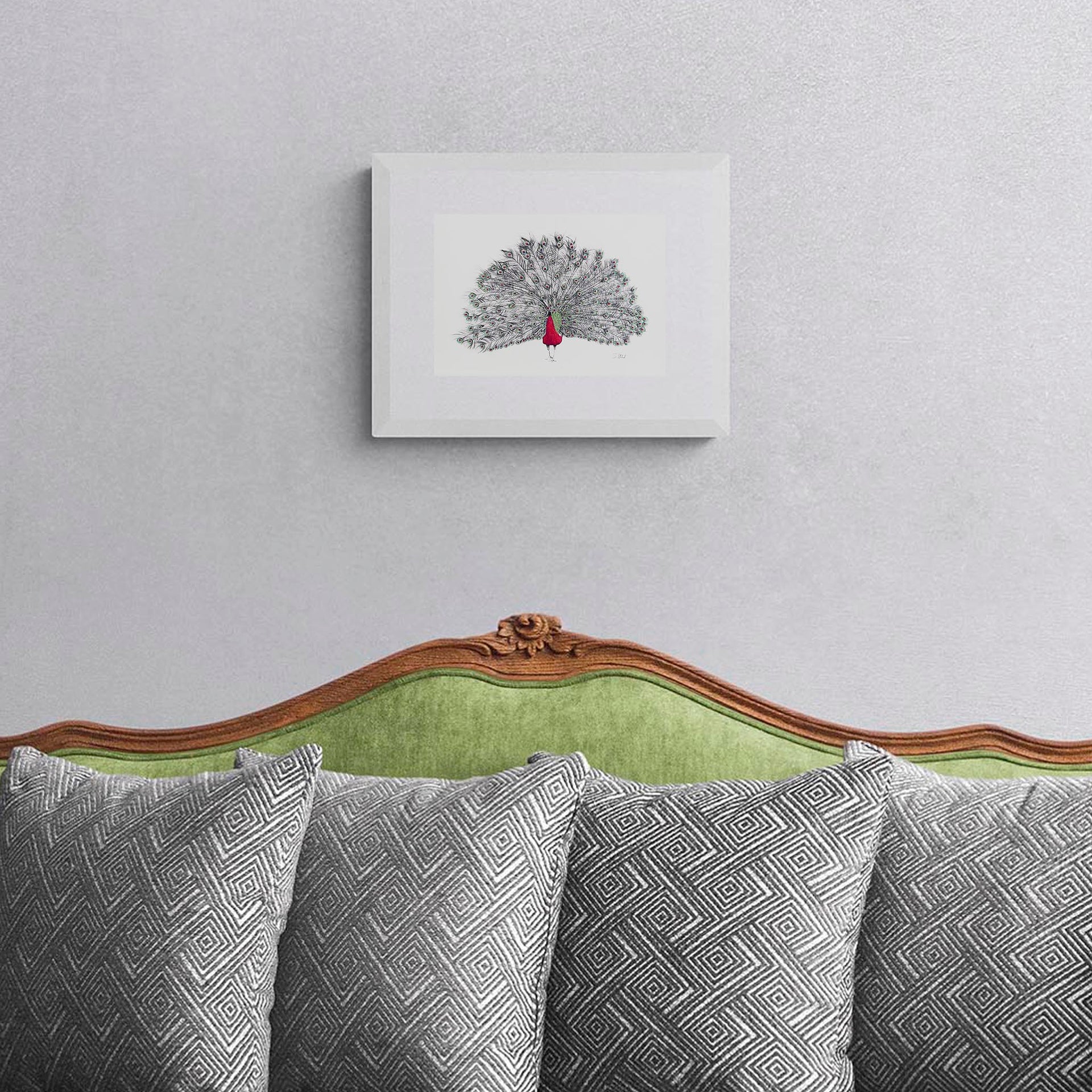 Peacock hand embroidered limited edition print in white frame on the wall